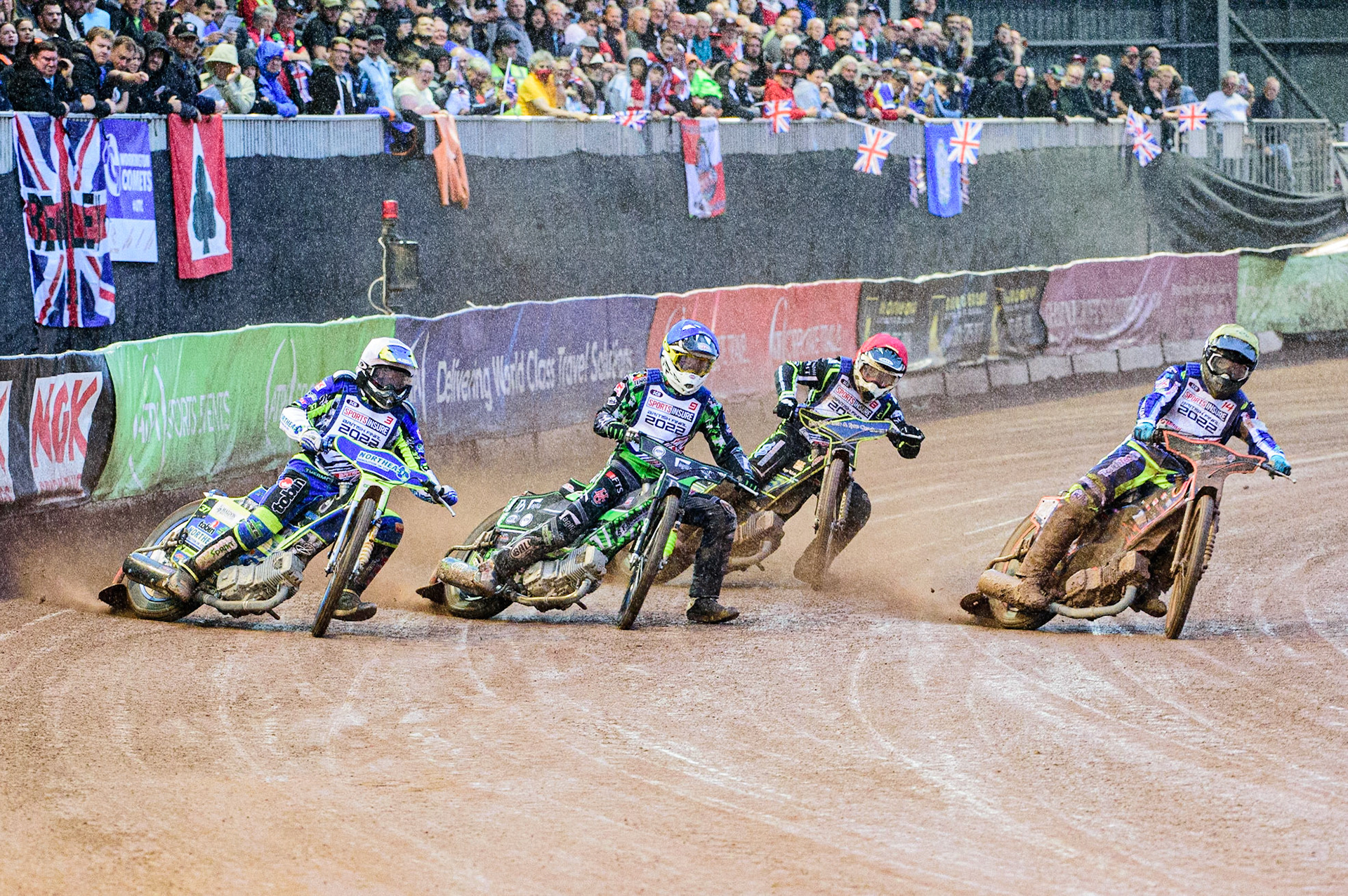 Heat 11 as the rain started falling heavily: Scott Nicholls  (Yellow) inside Charles Wright  (Blue) and Chris Harris  (White) with Danyon Hume (Red) behind during the Sports Insure British Speedway Championship Final at the National Speedway Stadium, Bellevue, Manchester, England on Monday 1st August 2022. (Photo by: Ian Charles | MI News)