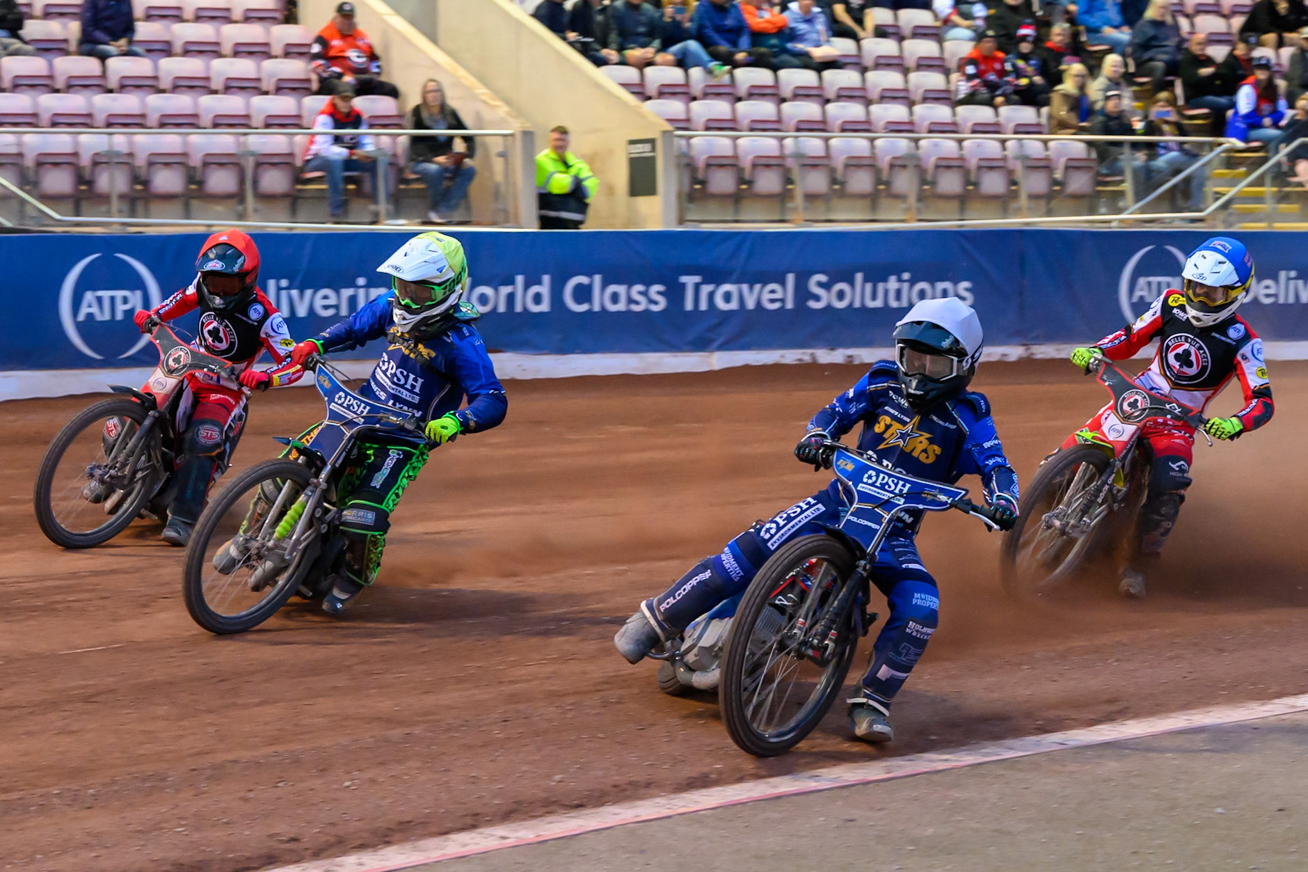 Kings Lynn Stars' Ben Cook in White rides inside Kings Lynn Stars' Luke Harrison in Yellow Belle Vue Aces' Zach Cook in Red and Belle Vue Aces' Tate Zischke in Blue behind during the Rowe Motor Oil Premiership match between Belle Vue Aces and King's Lynn Stars at the National Speedway Stadium, Manchester on Monday 23rd June 2025. (Photo: Ian Charles | MI News)