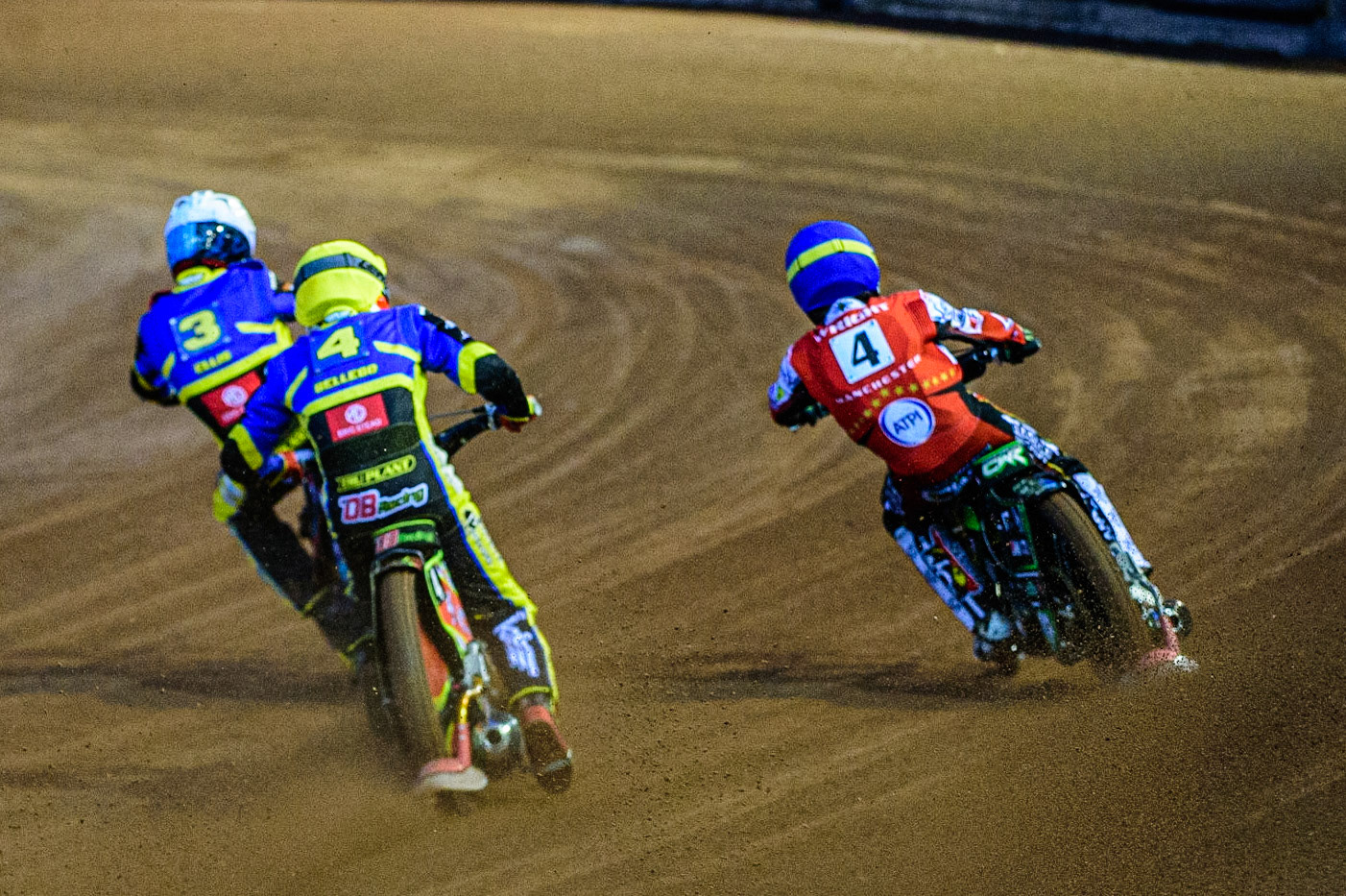 Adam Ellis  (White) and David Bellego  (Yellow) inside Charles Wright  (Blue) during the SGB Premiership match between Belle Vue Aces and Sheffield Tigers at the National Speedway Stadium, Manchester on Monday 27th March 2023. (Photo: Ian Charles | MI News)