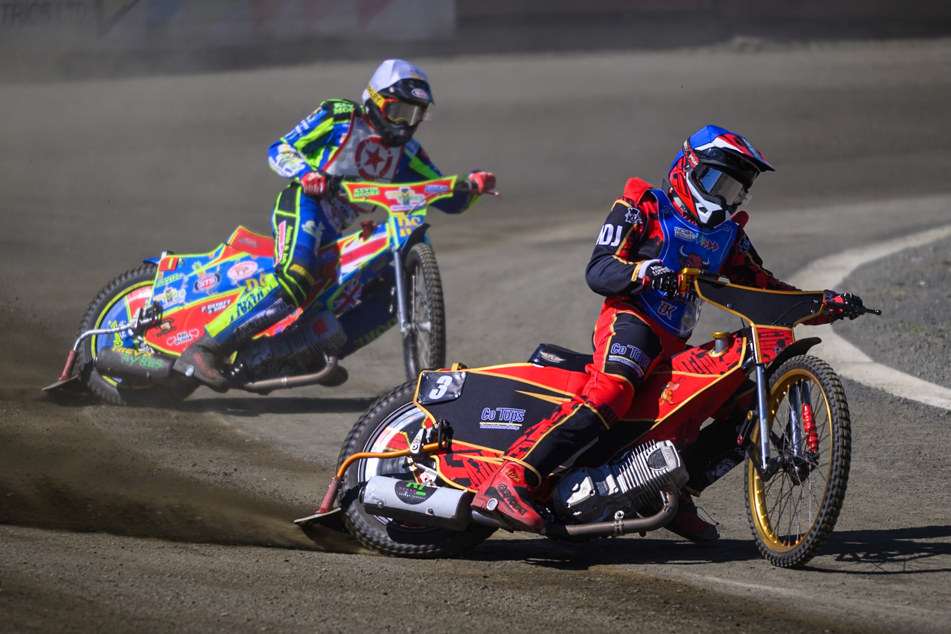 Luke Harris of Buxton Bulls in Blue leading Simon Lambert of Stoke Potters in White during the National Development League Challenge match between Buxton Bulls and Stoke Potters at Hi-Edge Speedway, Buxton on Sunday 24th May 2026. (Photo: Ian Charles | MI News)