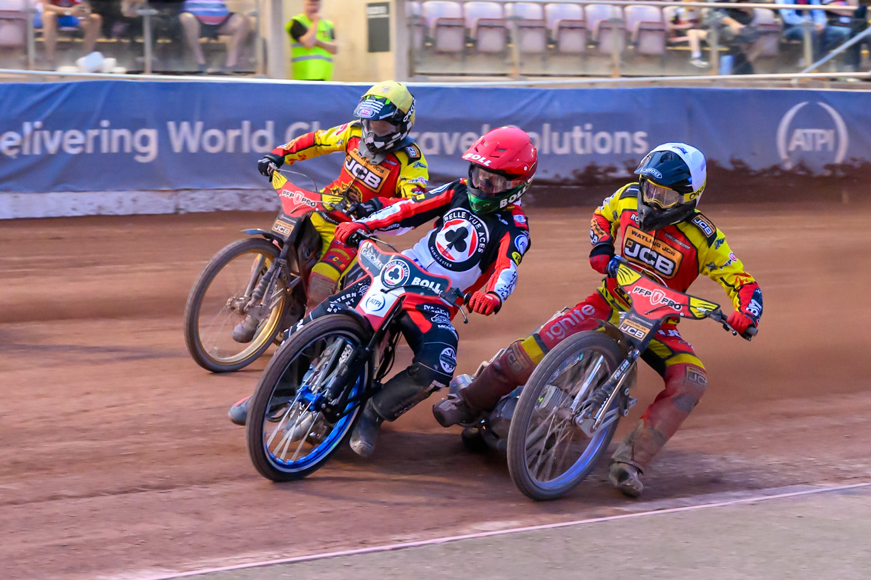 Brady Kurtz of Belle Vue Aces in Red leading Ryan Douglas of Leicester Lions in White  and Joe Thompson of Leicester Lions in Yellow  during the Rowe Motor Oil Premiership match between Belle Vue Aces and Leicester Lions at the National Speedway Stadium, Manchester on Monday 3rd August 2026. (Photo: Ian Charles | MI News)