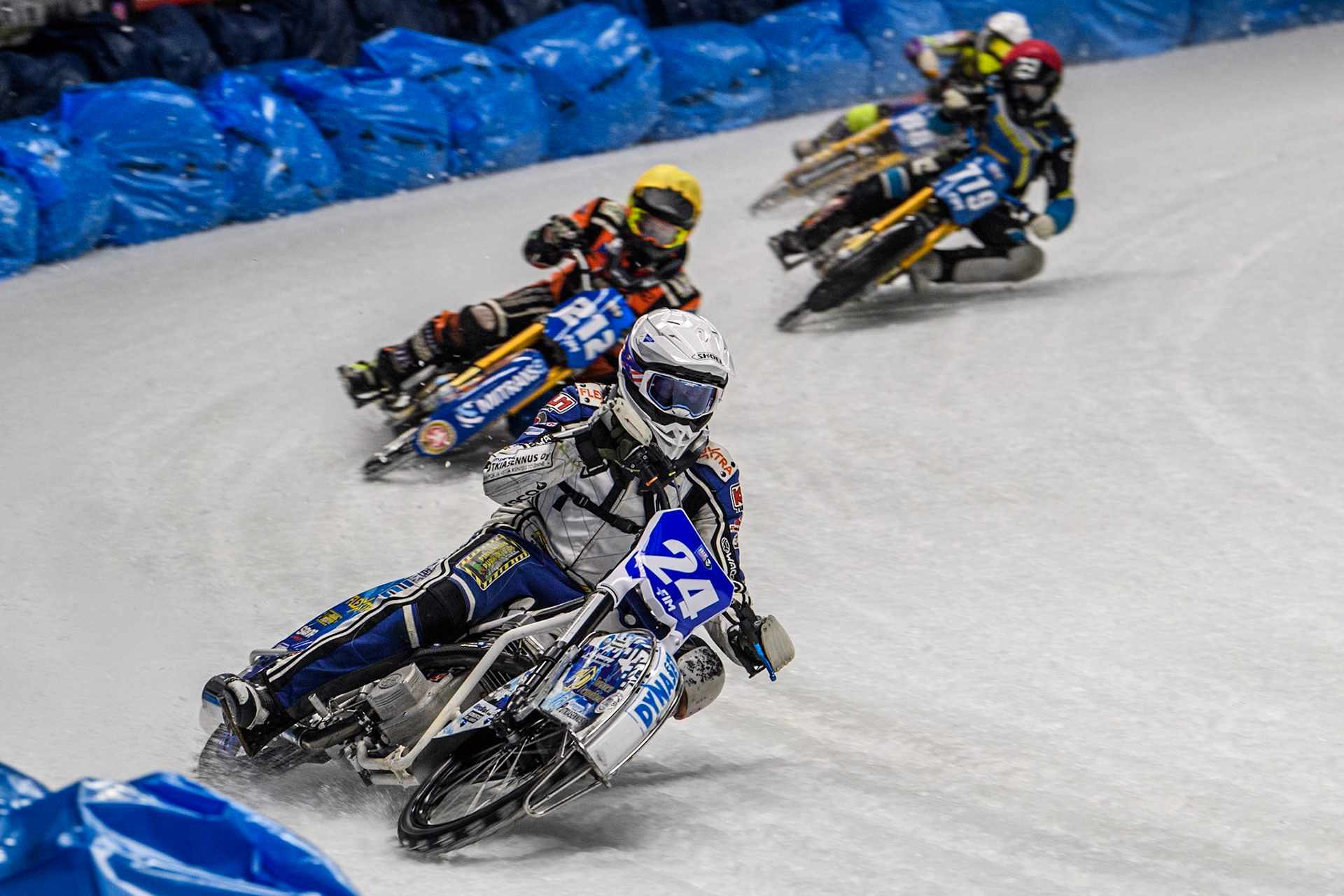 Max Koivula (24) of Finland in White leading Lukas Hutla (212) of the Czech Republic in Yellow, Filip Jäger (719) of Sweden in Red and Max Niedermaier  (88) of Germany in Blue during the Ice Speedway Gladiators World Championship Final 1 at Max-Aicher-Arena, Inzell on Saturday 15th March 2025. (Photo: Ian Charles | MI News)