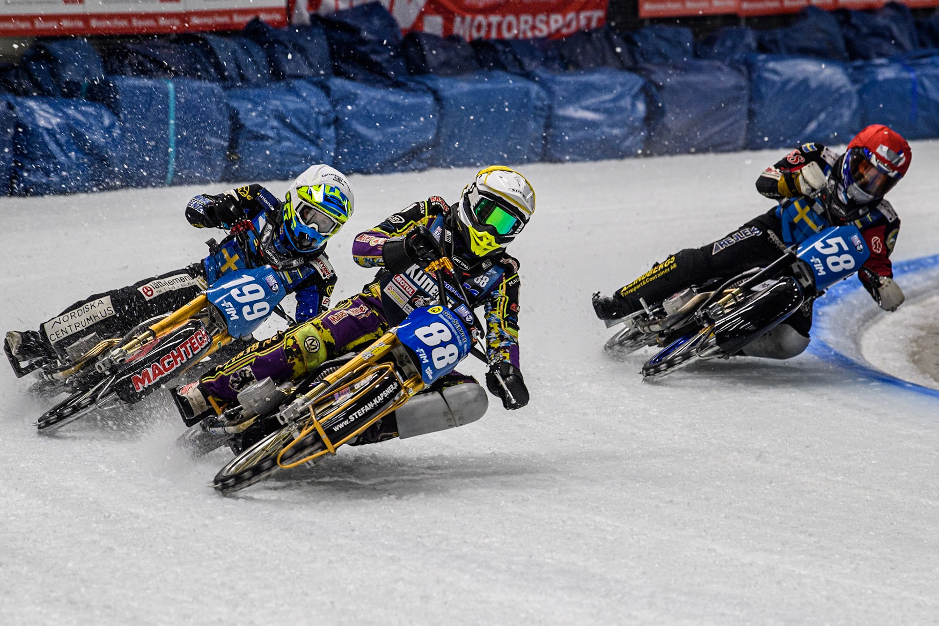 Germany's Max Niedermaier (88) (Yellow) leads  Sweden's Martin Haarahiltunen (199)  (White) and Sweden's Stefan Svensson (58) (Red) during the FIM Ice Speedway Gladiators World Championship Final 1 at the Max-Aicher-Arena, Inzell on Saturday 23 March 2024. (Photo: Ian Charles | MI News)