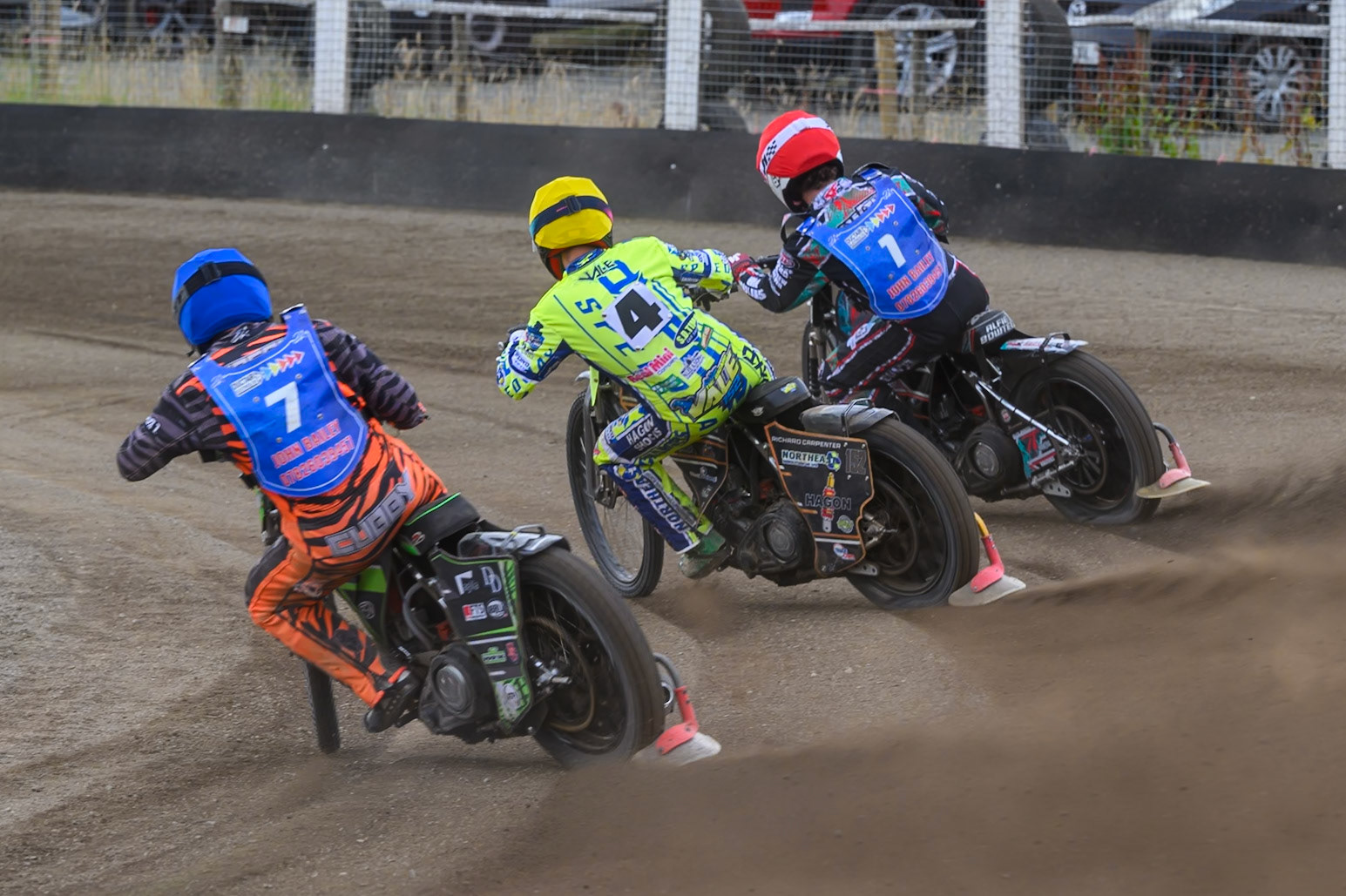 Jack Roberts of Buxton Bulls in Blue chases Ashton Vale of Oxford Chargers in Yellow and Alfie Bowtell of Buxton Bulls in Red  during the WSRA National Development League match between Buxton Bulls and Oxford Chargers at Hi-Edge Speedway, Buxton on Sunday 2nd August 2026. (Photo: Ian Charles | MI News)