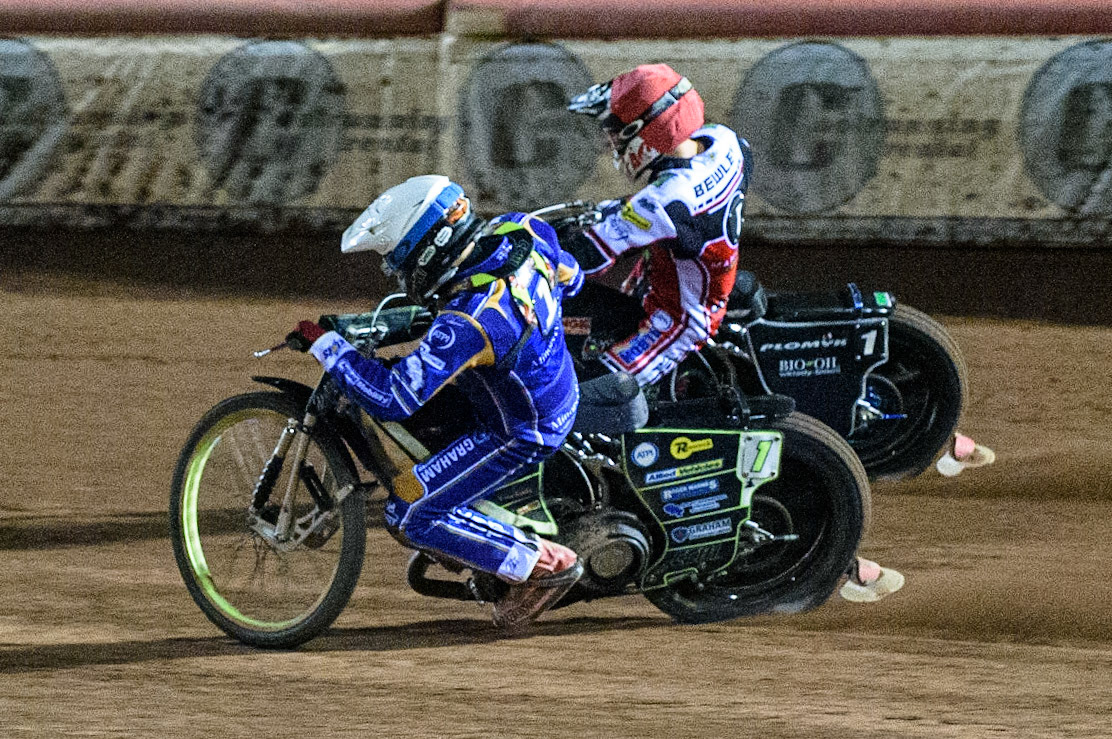 MANCHESTER, UK. SEPT 13TH  Craig Cook  (White) battles with Dan Bewley  (Red) during the SGB Premiership match between Belle Vue Aces and King's Lynn Stars at the National Speedway Stadium, Manchester on Monday 13th September 2021. (Credit: Ian Charles | MI News)