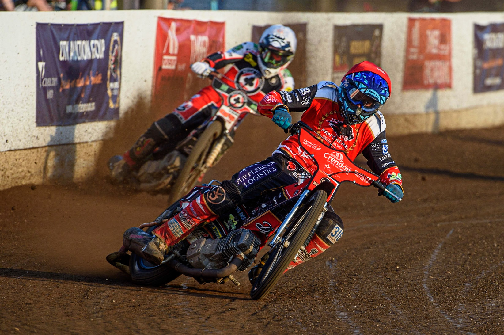 PETERBOROUGH, UK. JULY 19TH  Ulrich Ostergaard  (Red) leads Dan Bewley  (White) during the SGB Premiership match between Peterborough and Belle Vue Aces at East of England Showground, Peterborough on Monday 19th July 2021. (Credit: Ian Charles | MI News)