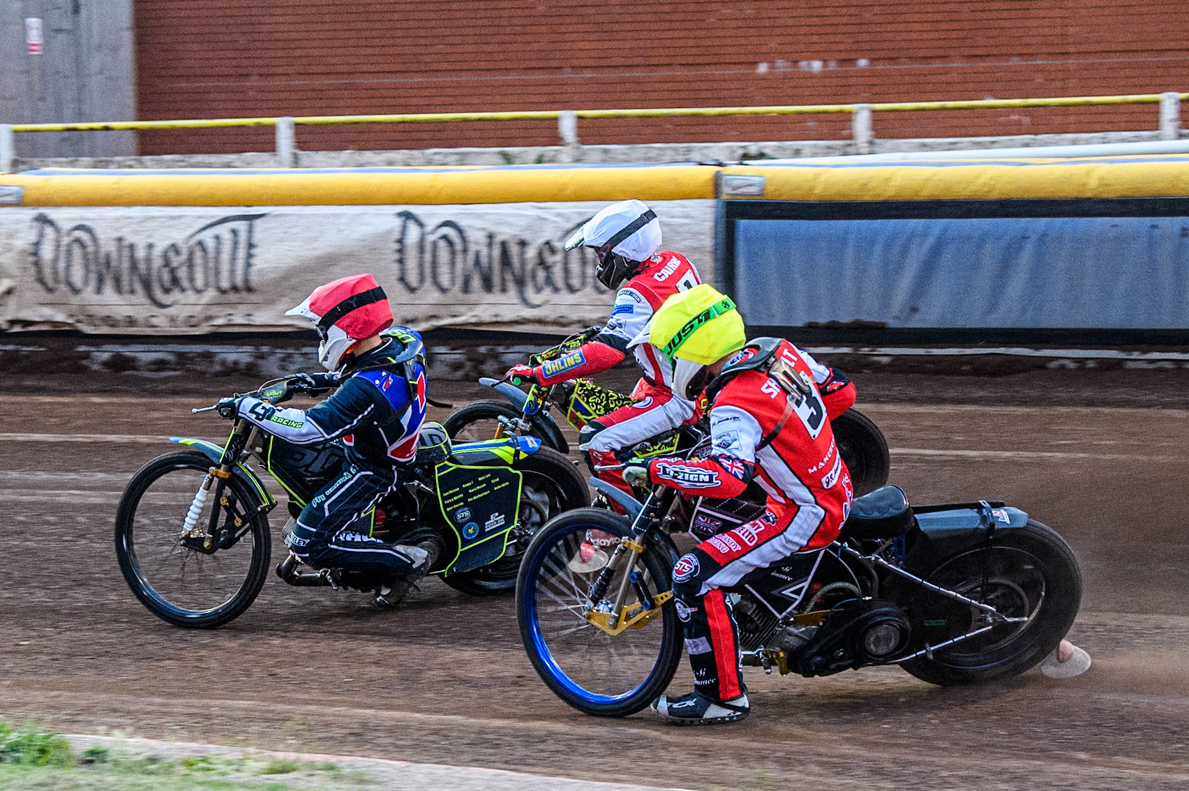 Belle Vue Colts' William Cairns in White rides outside Steelers' Nathan Ablitt in Red and Belle Vue Colts' Jack Shimelt in Yellow during the WSRA National Development League match between Steelers and Belle Vue Colts at Owlerton Stadium, Sheffield on Monday 5th May 2025. (Photo: Ian Charles | MI News)