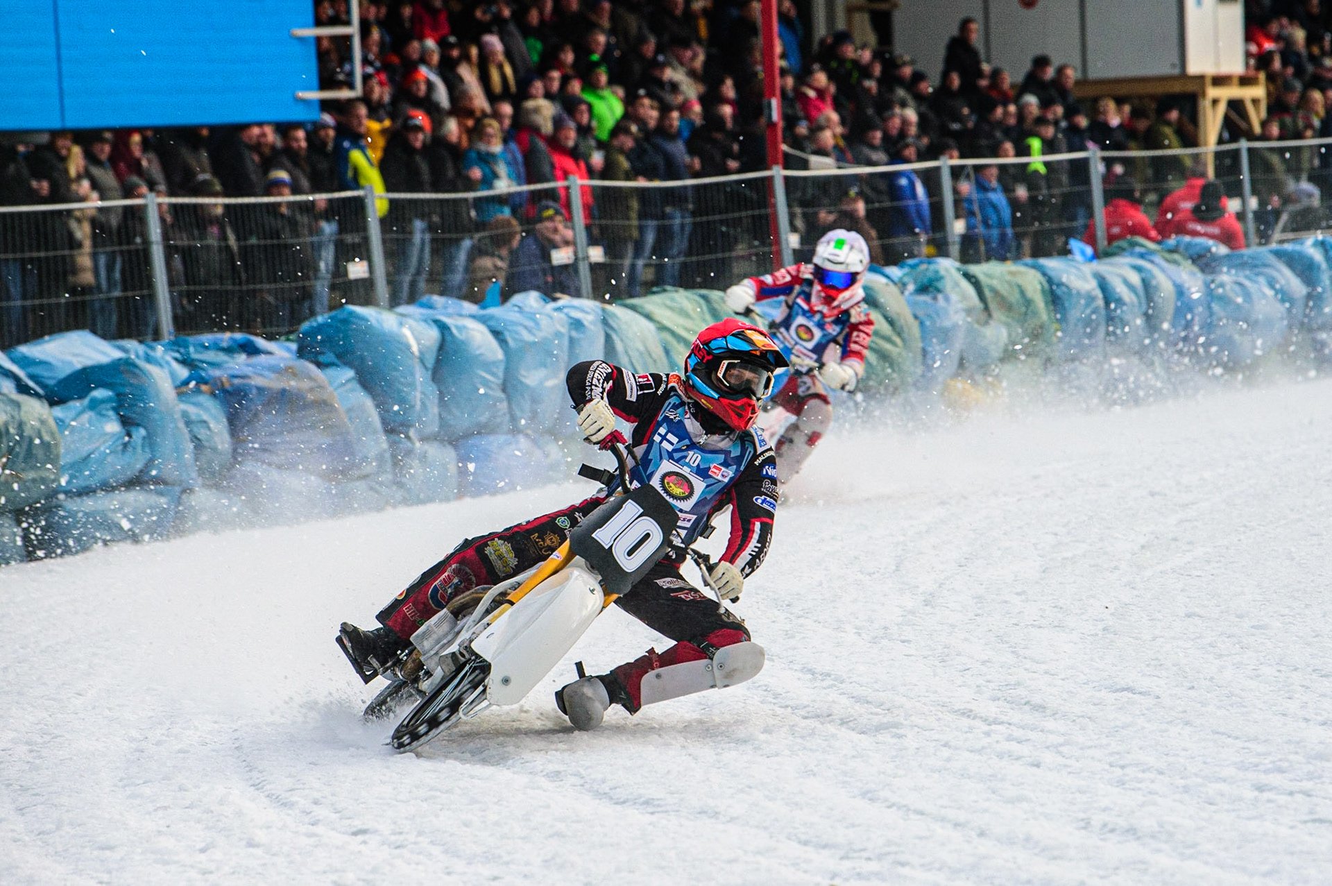 Topi Mustonen (Red) leads Niek Schaap (White) during the German Individual Ice Speedway Championship at Horst-Dohm-Eisstadion, Berlin on Friday 3rd March 2023. (Photo: Ian Charles | MI News)
