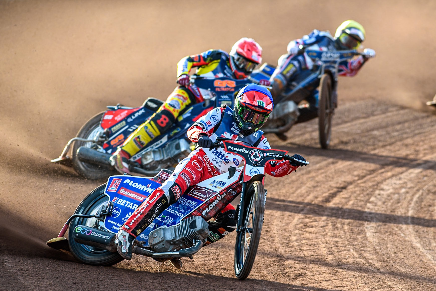 Belle Vue Aces' Norick Blodorn  in Blue leading Sheffield Tigers' Jack Holder in White, Sheffield Tigers' Kyle Howarth in Yellow and Belle Vue Aces' Dan Bewley in Red during the Rowe Motor Oil Premiership match between Belle Vue Aces and Sheffield Tigers at the National Speedway Stadium, Manchester on Monday 27th May 2024. (Photo: Ian Charles | MI News)