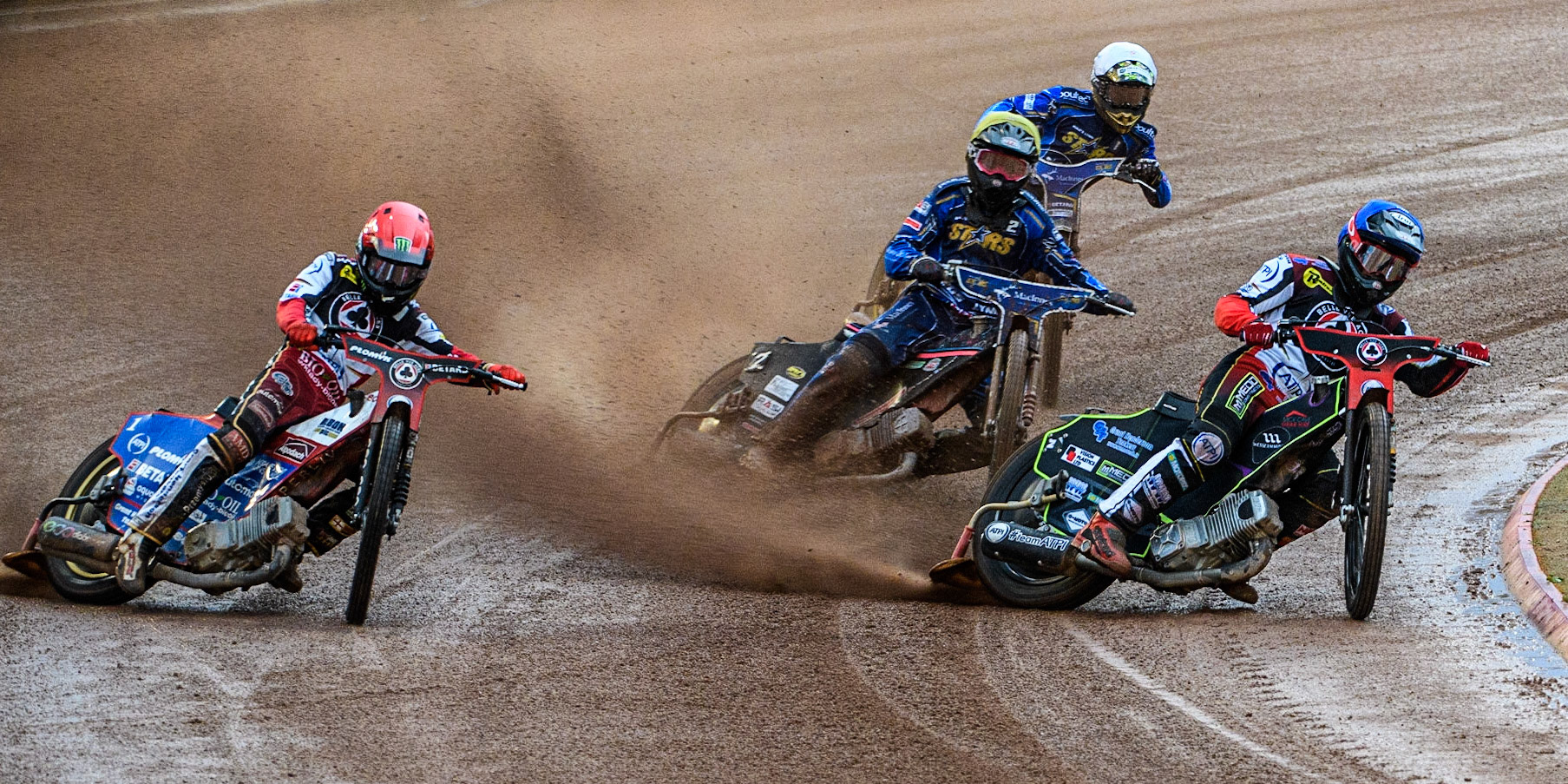 Tom Brennan (Blue) and Dan Bewley (Red) lead Thomas Jorgensen (Yellow) and Artem Laguta (White) during the Sports Insure Premiership match between Belle Vue Aces and King's Lynn Stars at the National Speedway Stadium, Manchester on Monday 12th June 2023. (Photo: Ian Charles | MI News)