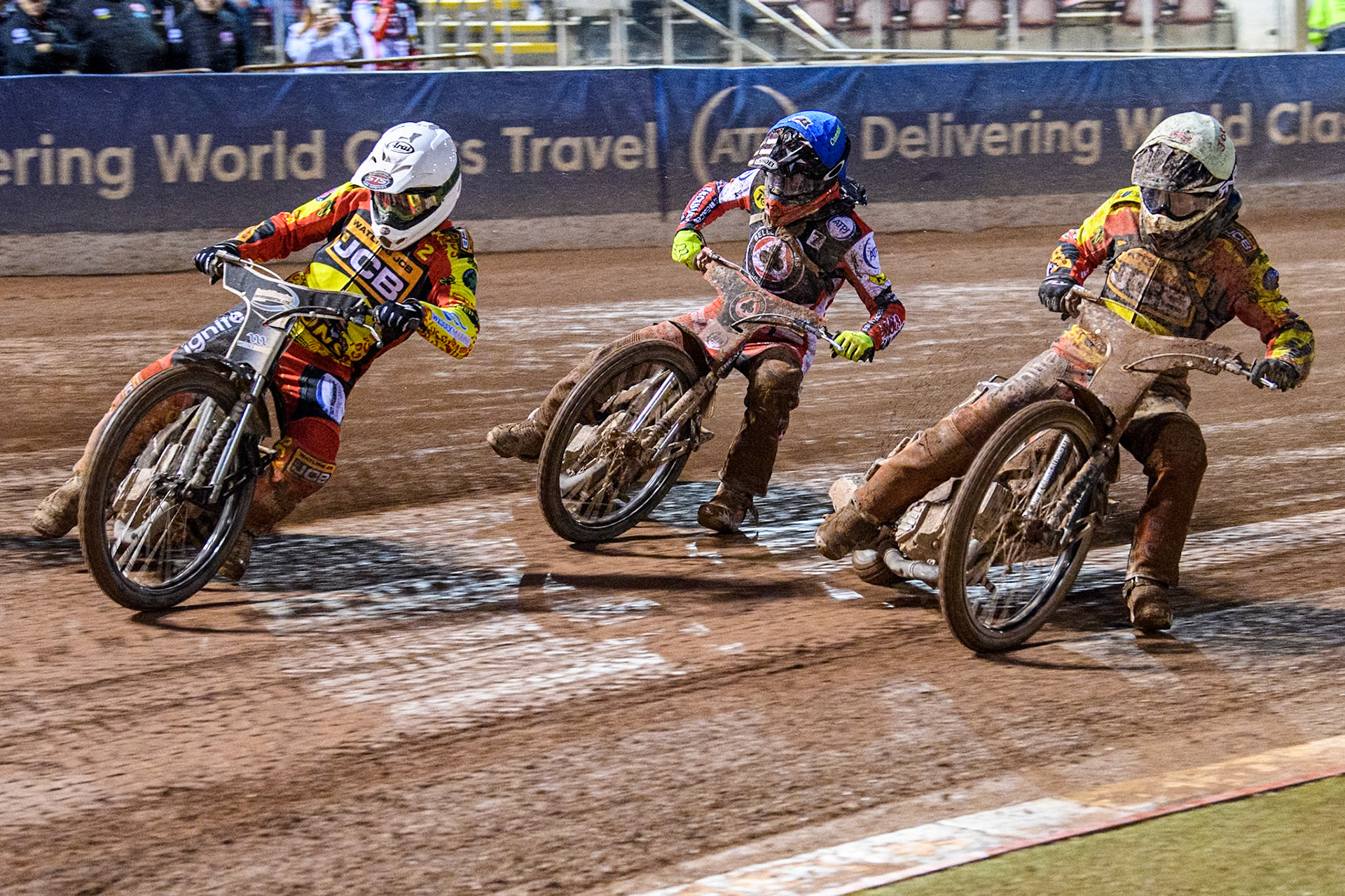Richard Lawson of Leicester Lions in White leading Connor Bailey of Belle Vue Aces in Blue and Joe Thompson of Leicester Lions in Yellow during the Rowe Motor Oil Premiership match between Belle Vue Aces and Leicester Lions at the National Speedway Stadium, Manchester on Saturday 6th April 2024. (Photo: Ian Charles | MI News)