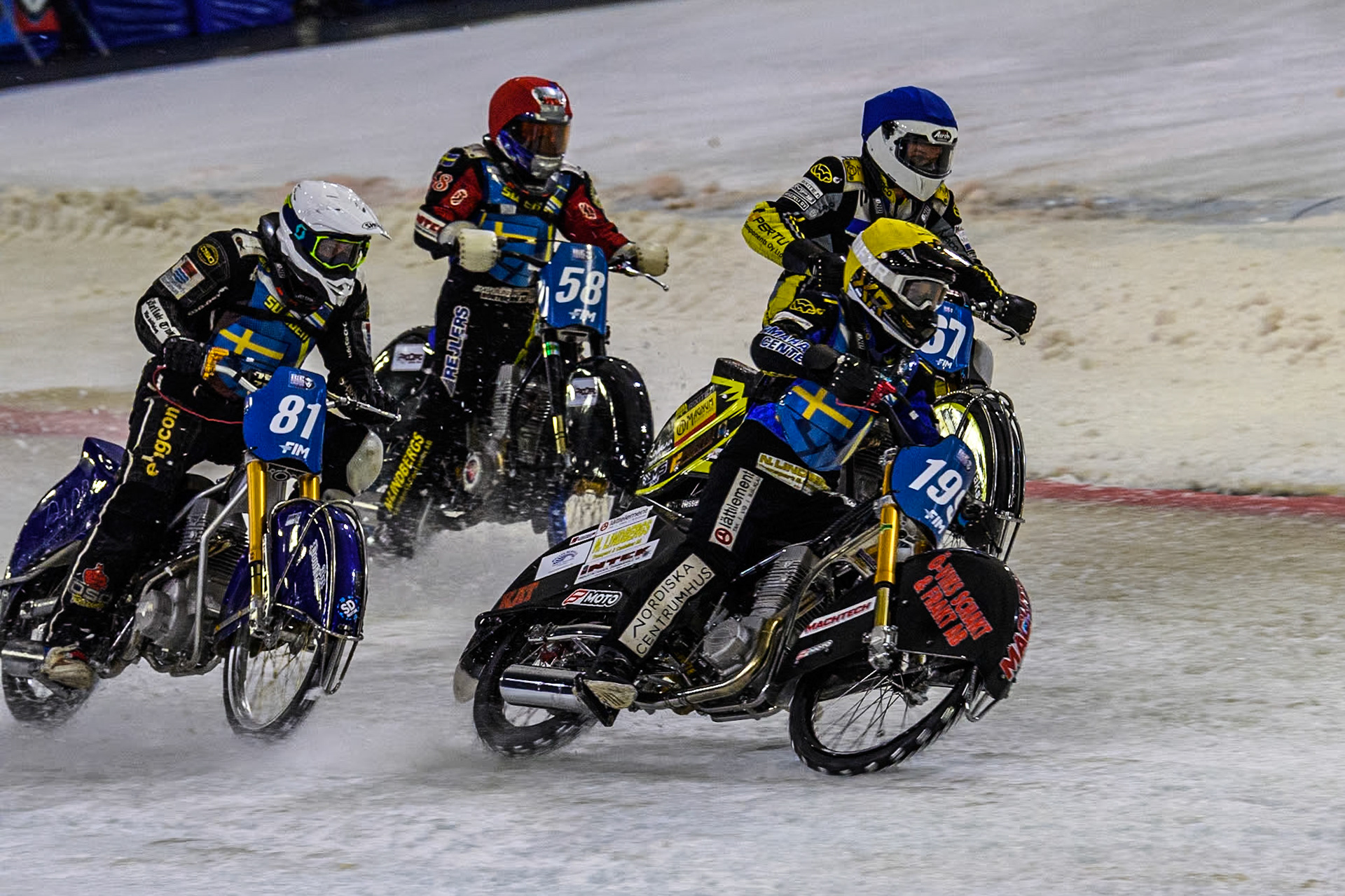 The Final: Sweden's Martin Haarahiltunen (199)  in Yellow cuts across Sweden"s Jimmy Olsén (81) in White, Sweden's Stefan Svensson (58) in Red and Finland's Heikki Huusko (67) in Blue during the FIM Ice Speedway Gladiators World Championship Final 4 at Ice Rink Thialf, Heerenveen on Sunday 7th April 2024. (Photo: Ian Charles | MI News)