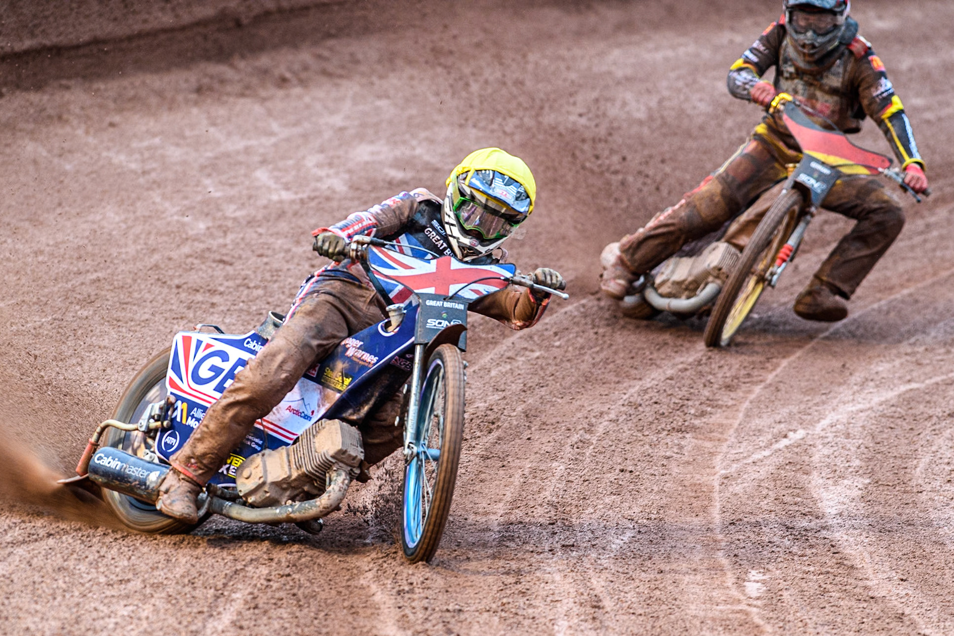 Leon Flint of Great Britain in Yellow leading Norick Blödorn of Germany in Red during the Monster Energy FIM Speedway of Nations 2 (Under 21) Final at the National Speedway Stadium, Manchester on Friday 12th July 2024. (Photo: Ian Charles | MI News)