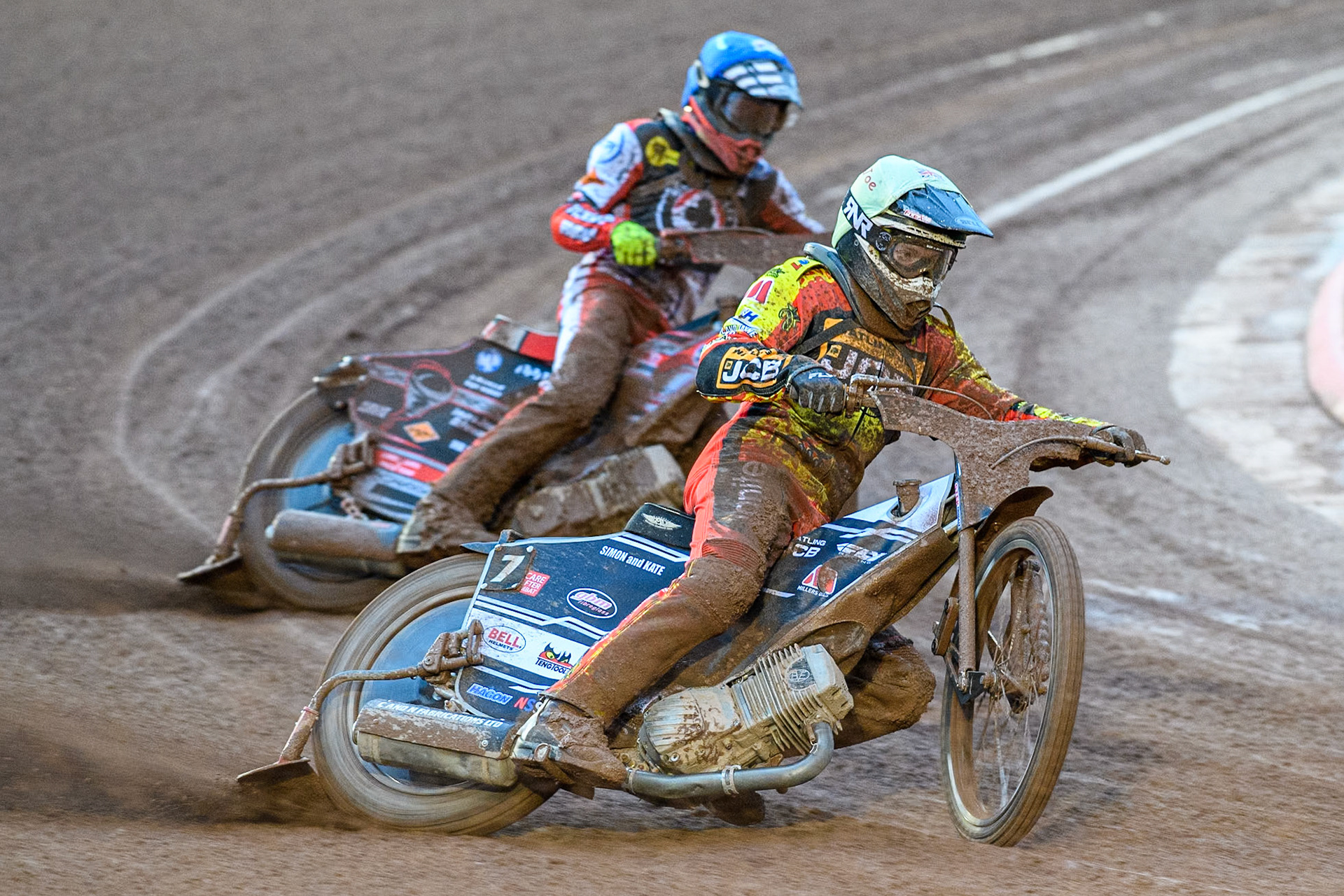 Joe Thompson of Leicester Lions in Yellow leading Connor Bailey of Belle Vue Aces in Blue during the Rowe Motor Oil Premiership match between Belle Vue Aces and Leicester Lions at the National Speedway Stadium, Manchester on Saturday 6th April 2024. (Photo: Ian Charles | MI News)