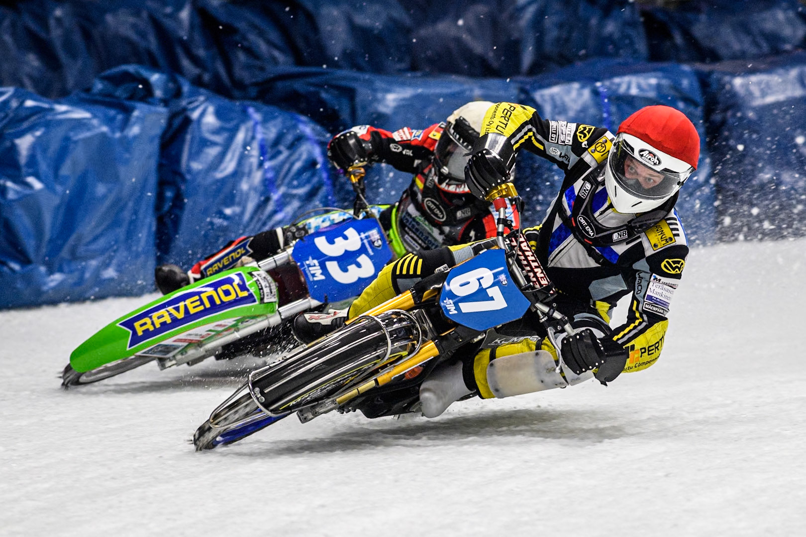 Finland's Heikki Huusko (67) (Red) passes Germany's Johann Weber (33) (White) during the FIM Ice Speedway Gladiators World Championship Final 1 at the Max-Aicher-Arena, Inzell on Saturday 23 March 2024. (Photo: Ian Charles | MI News)