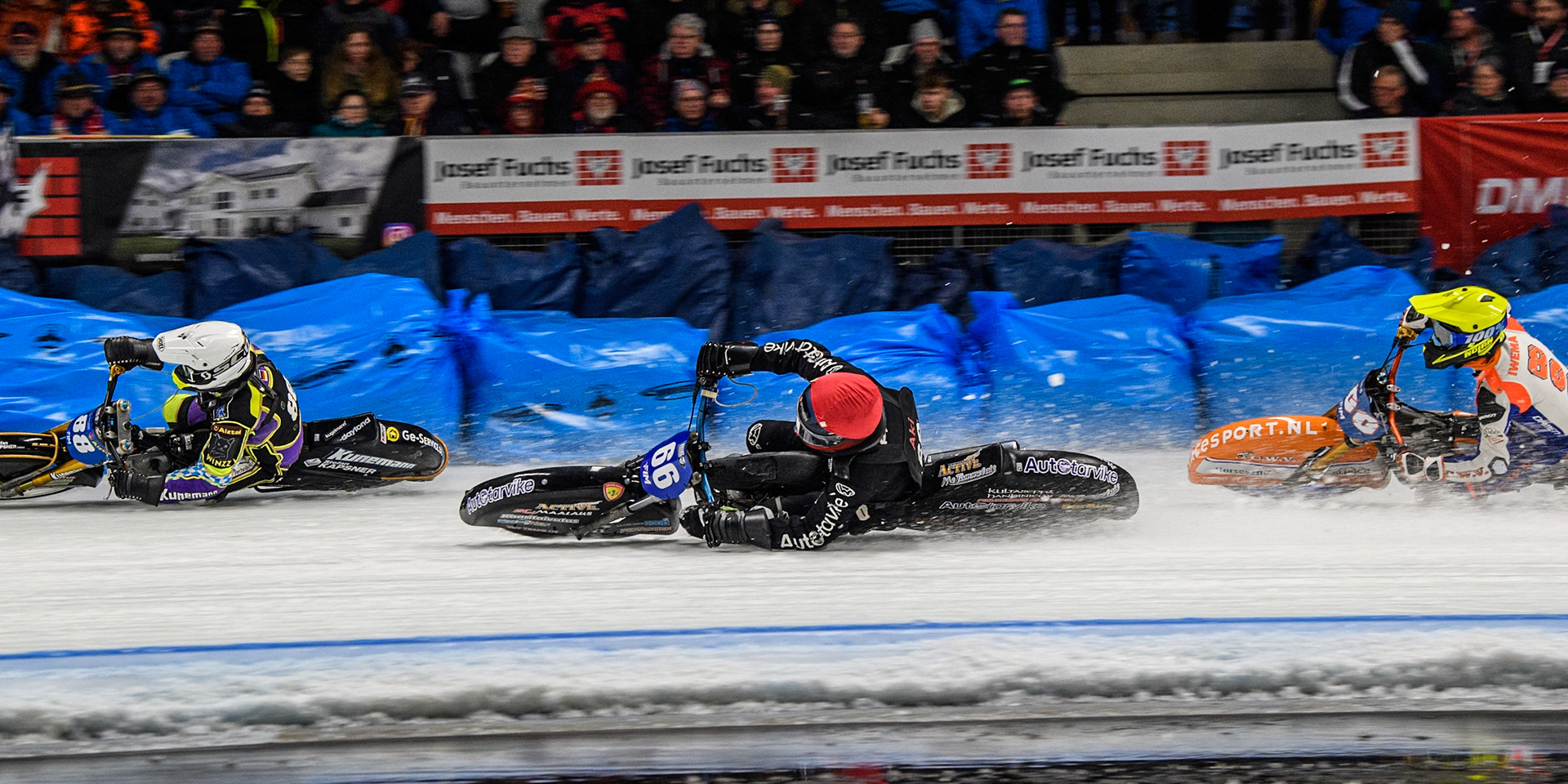 Aki Ala-Riihimäki (66) of Finland in Red rides inside Max Niedermaier  (88) of Germany in White and Jasper Iwema (800) of The Netherlands in Yellow during the Ice Speedway Gladiators World Championship Final 1 at Max-Aicher-Arena, Inzell on Saturday 15th March 2025. (Photo: Ian Charles | MI News)