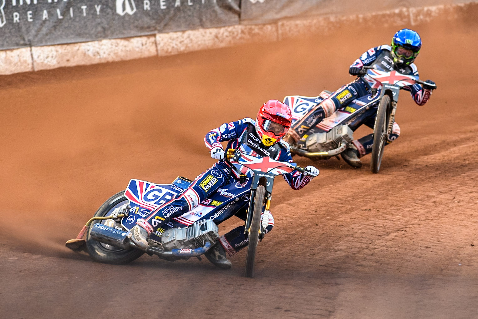 Robert Lambert of Great Britain in Red leading team mate Dan Bewley in Blue during the Monster Energy FIM Speedway of Nation Final at the National Speedway Stadium, Manchester on Saturday 13th July 2024. (Photo: Ian Charles | MI News)