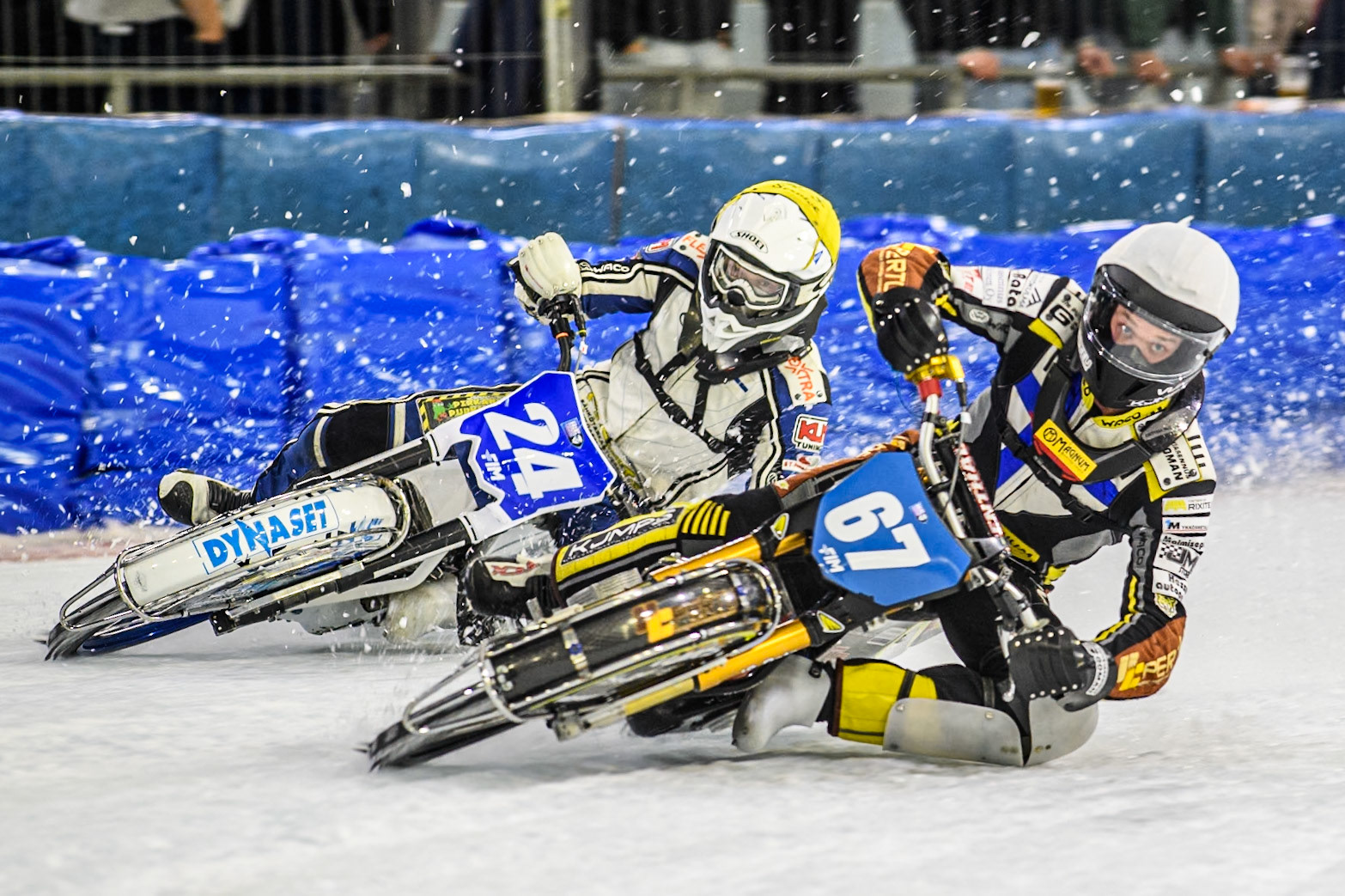 Heikki Huusko (67) of Finland \in White rides inside Max Koivula (24) of Finland in Yellow during the FIM Ice Speedway Gladiators World Championship, Final 3 at the Ice Stadium, Thialf, Heerenveen on Saturday 5th April 2025. (Photo: Ian Charles | MI News)