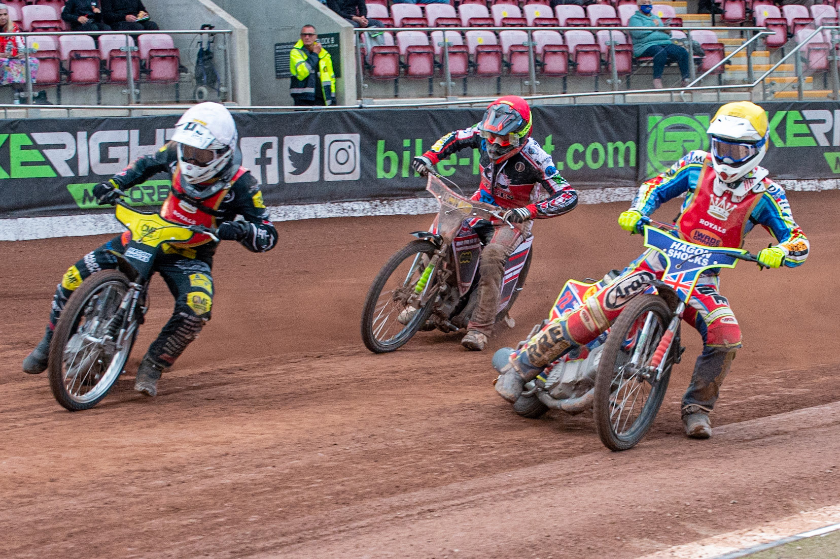 MANCHESTER, UK. JULY 2ND  Daniel Gilkes  (White) and Jake Mulford  (Yellow) make the start over Jack Parkinson-Blackburn  (Red) during the National Development League match between Belle Vue Colts and Kent Royals at the National Speedway Stadium, Manchester on Friday 2nd July 2021. (Credit: Ian Charles | MI News)