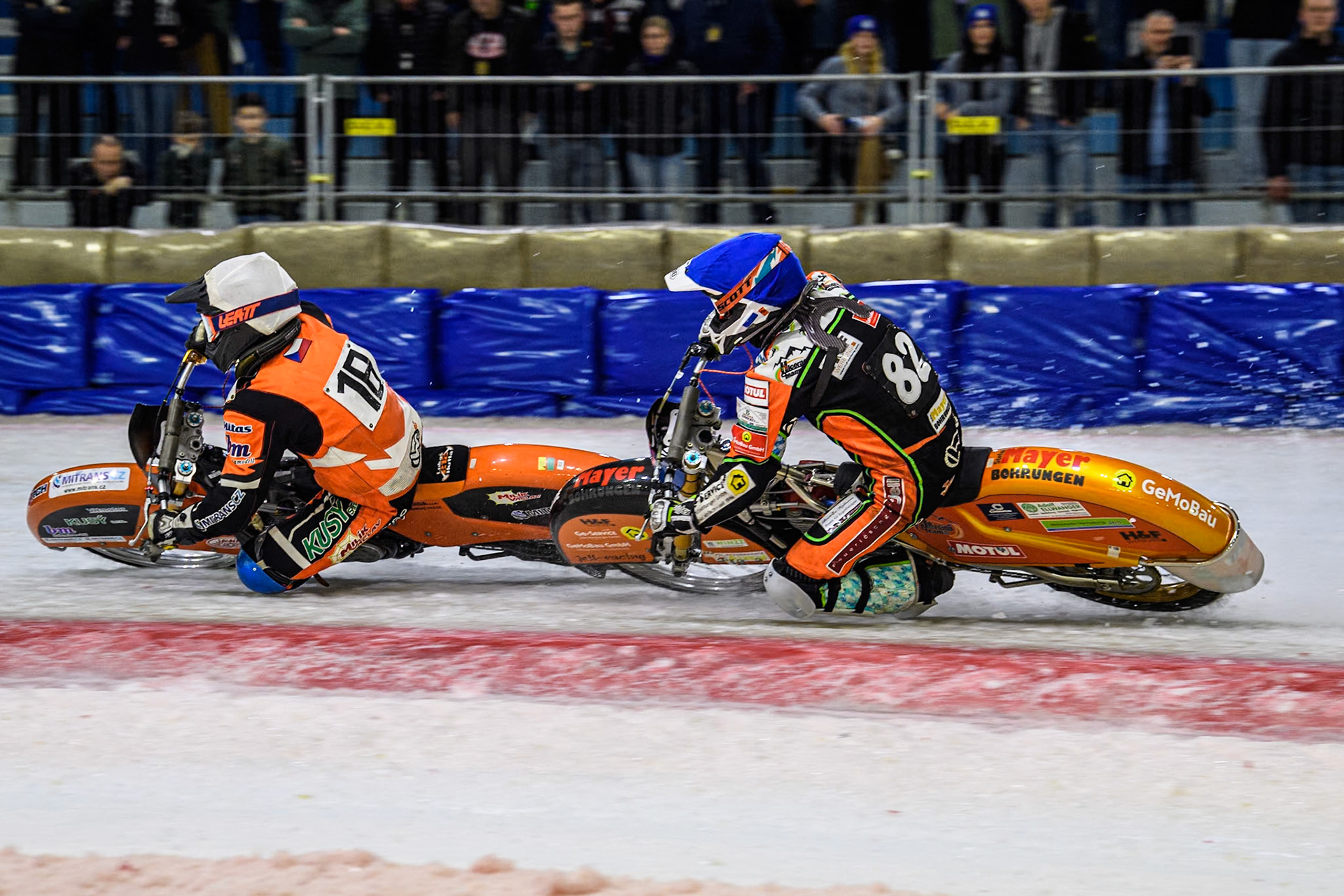 Reserve Czech Republic's Lukáš Hutla (18) in White leading Germany's Markus Jell (82) in Blue during the FIM Ice Speedway Gladiators World Championship Final 3 at Ice Rink Thialf, Heerenveen on Saturday 6th April 2024. (Photo: Ian Charles | MI News)