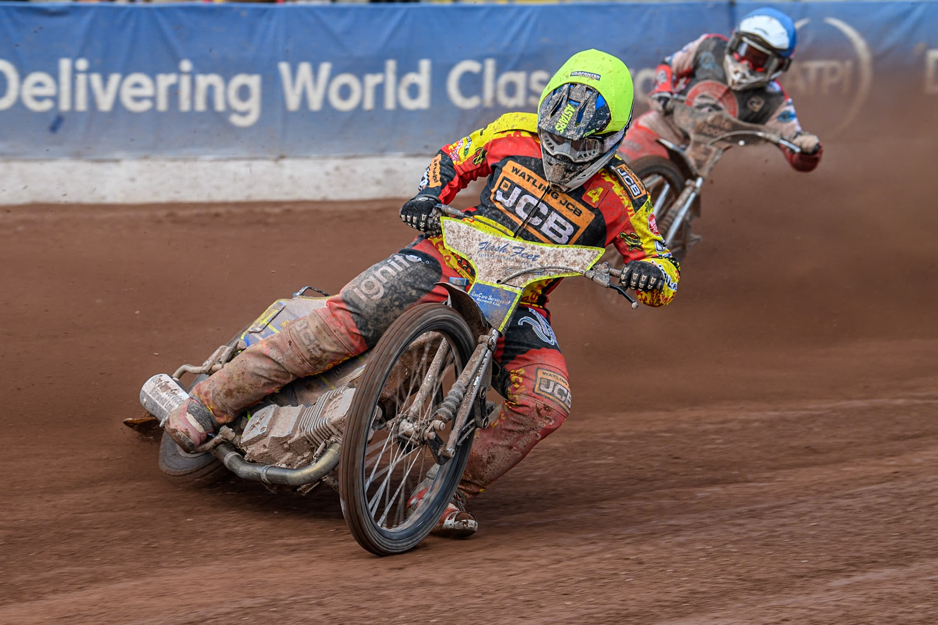 Leicester Lion Cubs' Arran Butcher (Yellow) leads  Belle Vue Colts' Chad Wirtzfeld (Blue) during the WSRA National Development League match between Belle Vue Colts and Leicester Lion Cubs at the National Speedway Stadium, Manchester on Friday 29th March 2024. (Photo: Ian Charles | MI News)