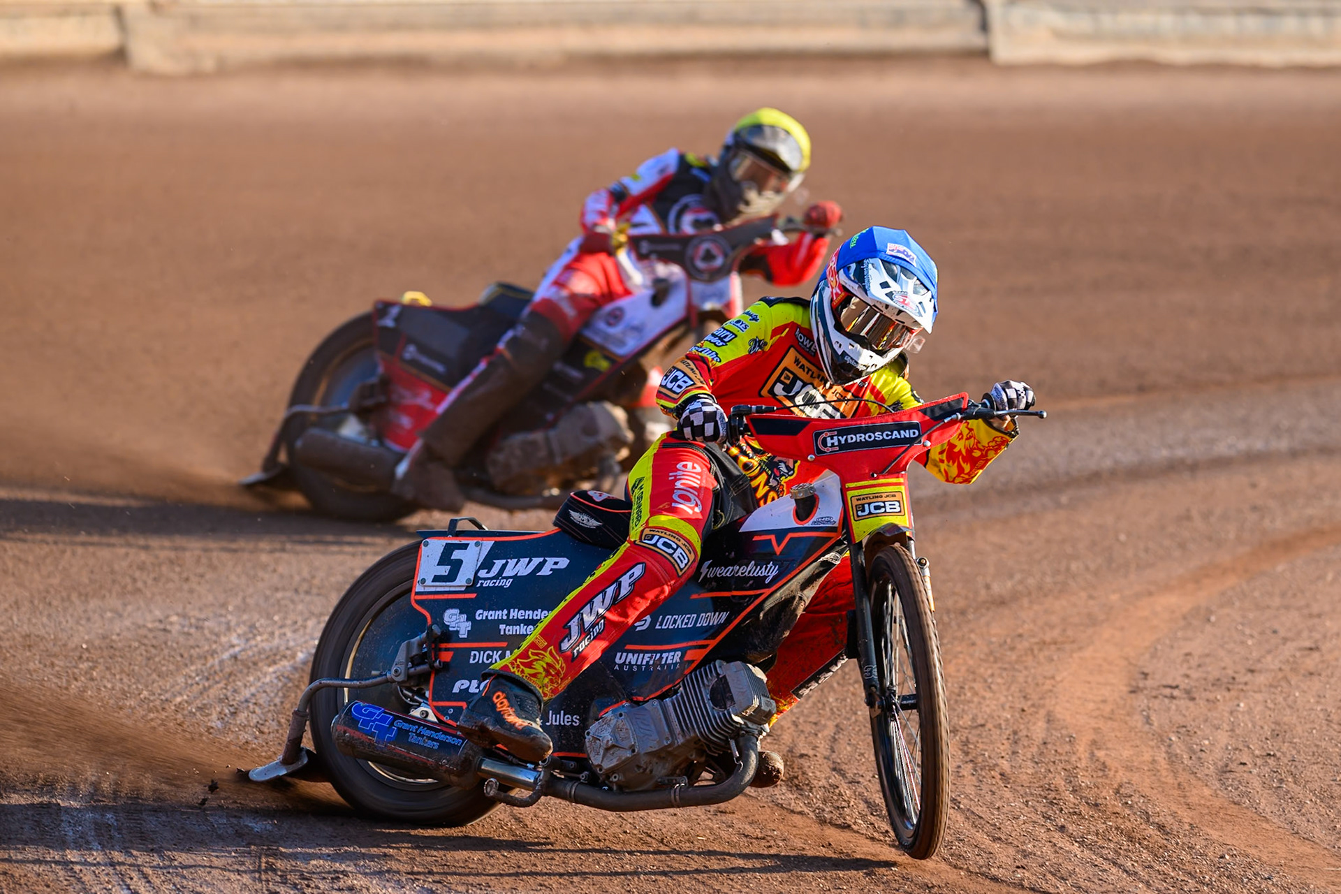 Leicester Lions' Sam Masters in Blue leading Belle Vue Aces' Norick Blodorn in Yellow during the Rowe Motor Oil Premiership match between Leicester Lions and Belle Vue Aces at the Hydroscand Arena, Leicester on Thursday 19th June 2025. (Photo: Ian Charles | MI News)