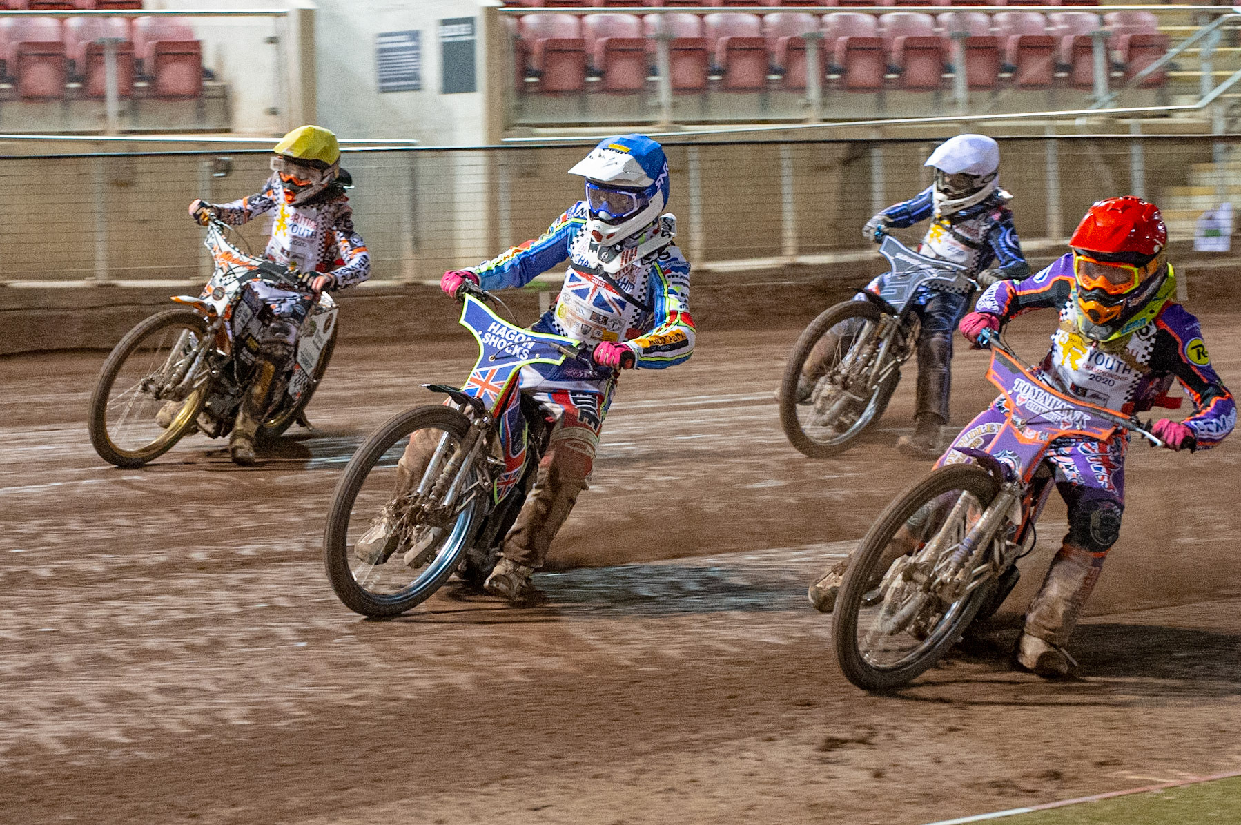 Photo: Ian CharlesElliot Kelly (Red) and Jake Mulford (Blue) lead Sam McGurk (White) and Mickey Simpson (Yellow) (500cc A Class)British Youth Speedway Championship (Round 5), National Speedway Stadium, Manchester Saturday  10  October  2020