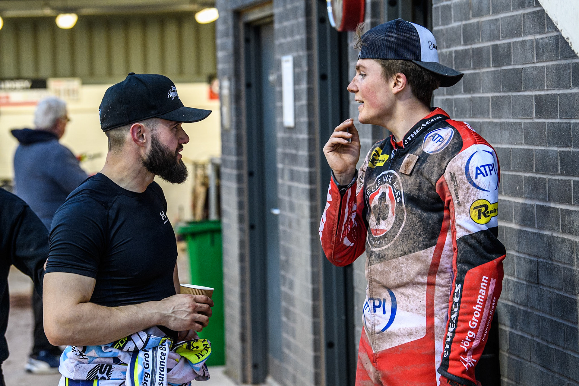 Oxford Spires' Erik Riss (Left) chats with fellow German rider Belle Vue Aces' Norick Blodorn during the Rowe Motor Oil Premiership match between Belle Vue Aces and Oxford Spires at the National Speedway Stadium, Manchester on Monday 13th May 2024. (Photo: Ian Charles | MI News)
