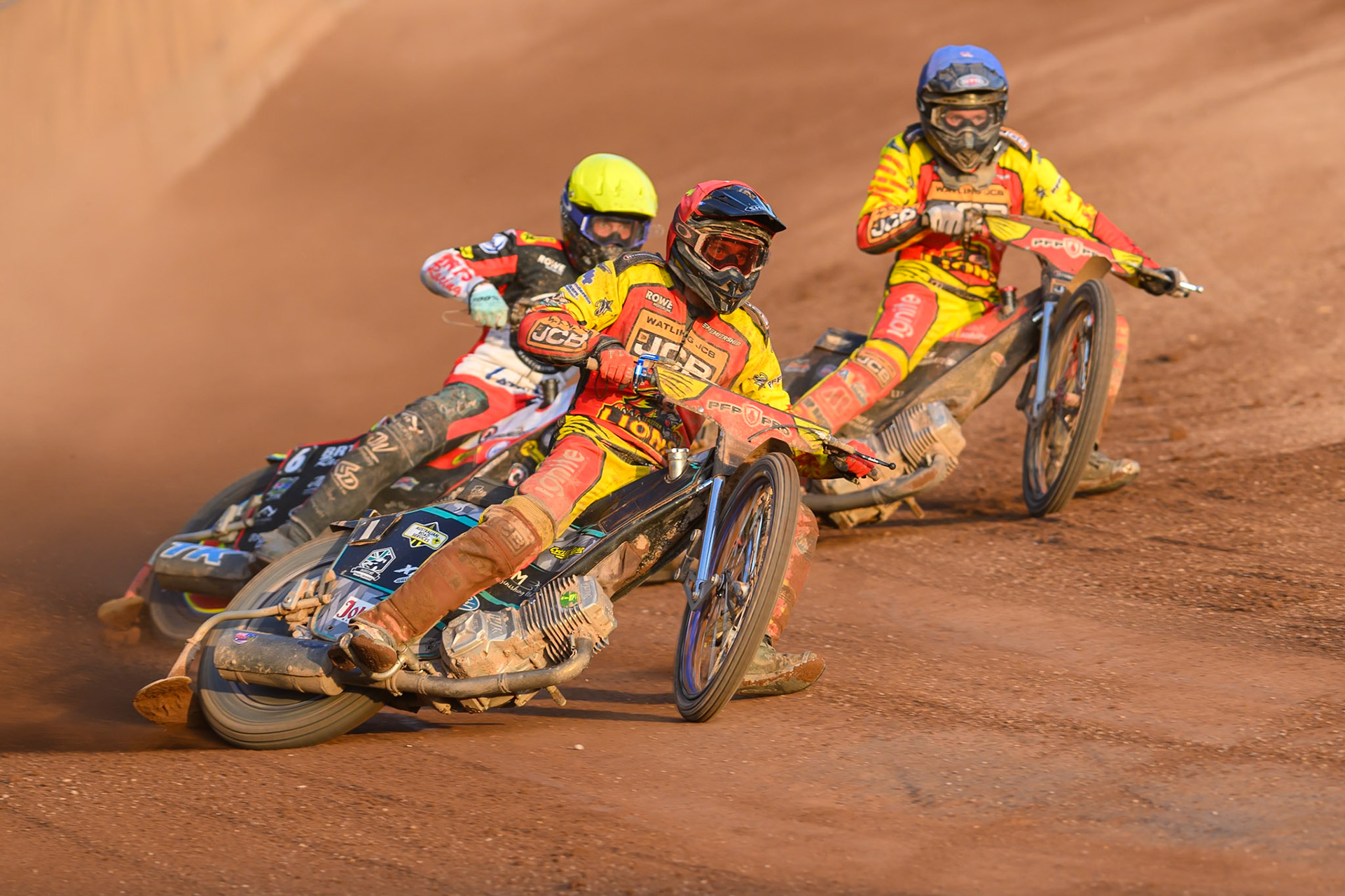 Ryan Douglas of Leicester Lions in Red leading Tate Zischke of Belle Vue Aces in Yellow and Dan Thompson of Leicester Lions  in Blue during the Rowe Motor Oil Premiership match between Leicester Lions and Belle Vue Aces at the Hydroscan Arena, Leicester on Thursday 23rd July 2026. (Photo: Ian Charles | MI News)