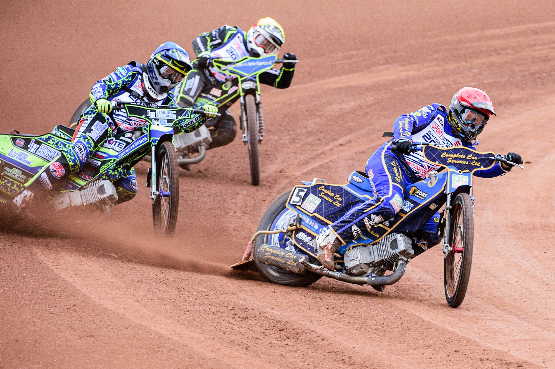 Kyle Howarth  (Red) leads Paul Starke  (Blue) and Danyon Hume (Yellow) during the Sports Insure British Speedway Championship Final at the National Speedway Stadium, Bellevue, Manchester, England on Monday 1st August 2022. (Photo by: Ian Charles | MI News)