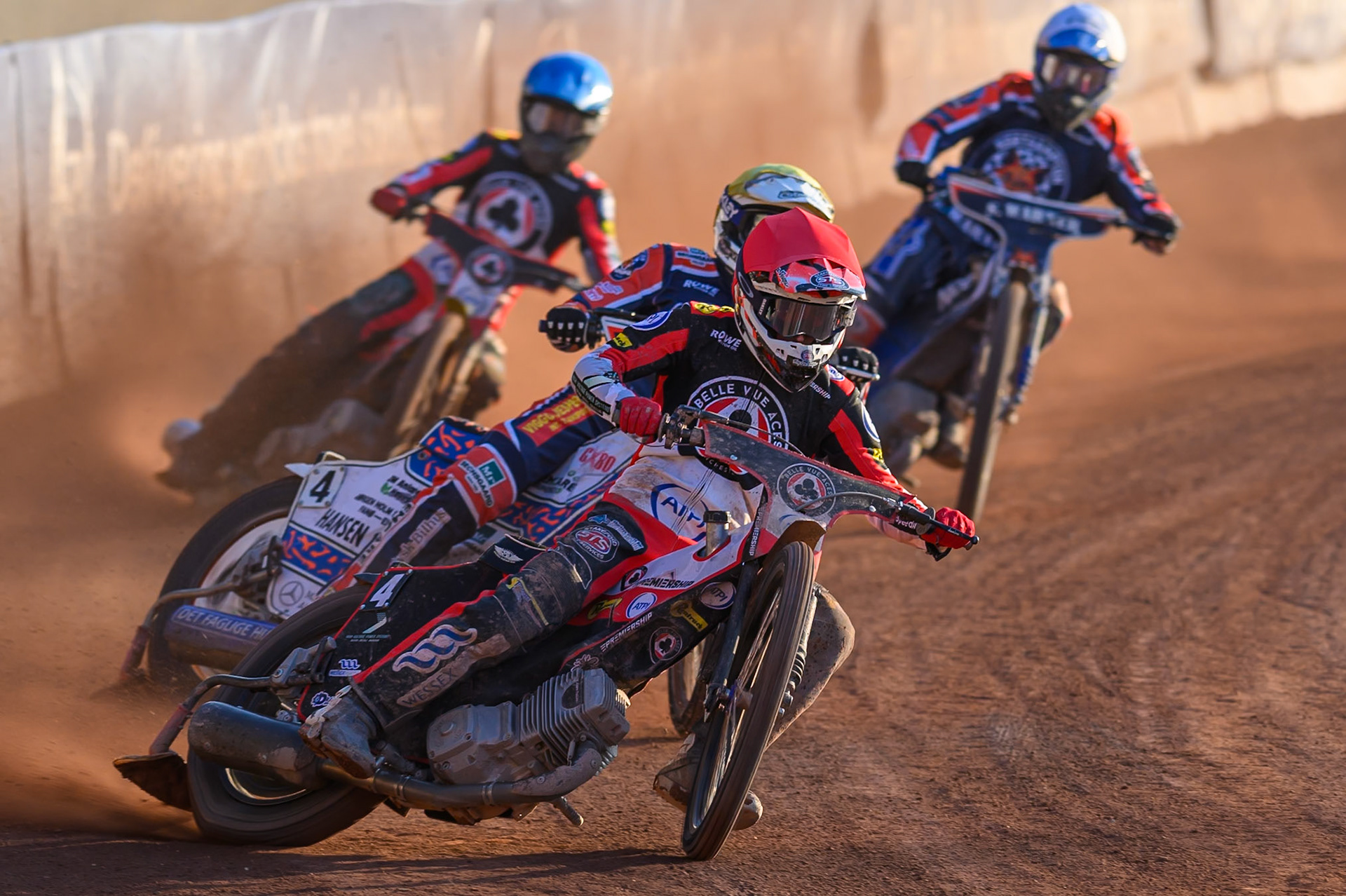 Zach Cook of Belle Vue Aces  in Red leading Niels-Kristian Iversen of Northampton Foxes in Yellow Tate Zischke of Belle Vue Aces in Blue  and Matej Zagar of Northampton Foxes in White during the Rowe Motor Oil Premiership match between Belle Vue Aces and Northampton Foxes at the National Speedway Stadium, Manchester on Monday 13th July 2026. (Photo: Ian Charles | MI News)