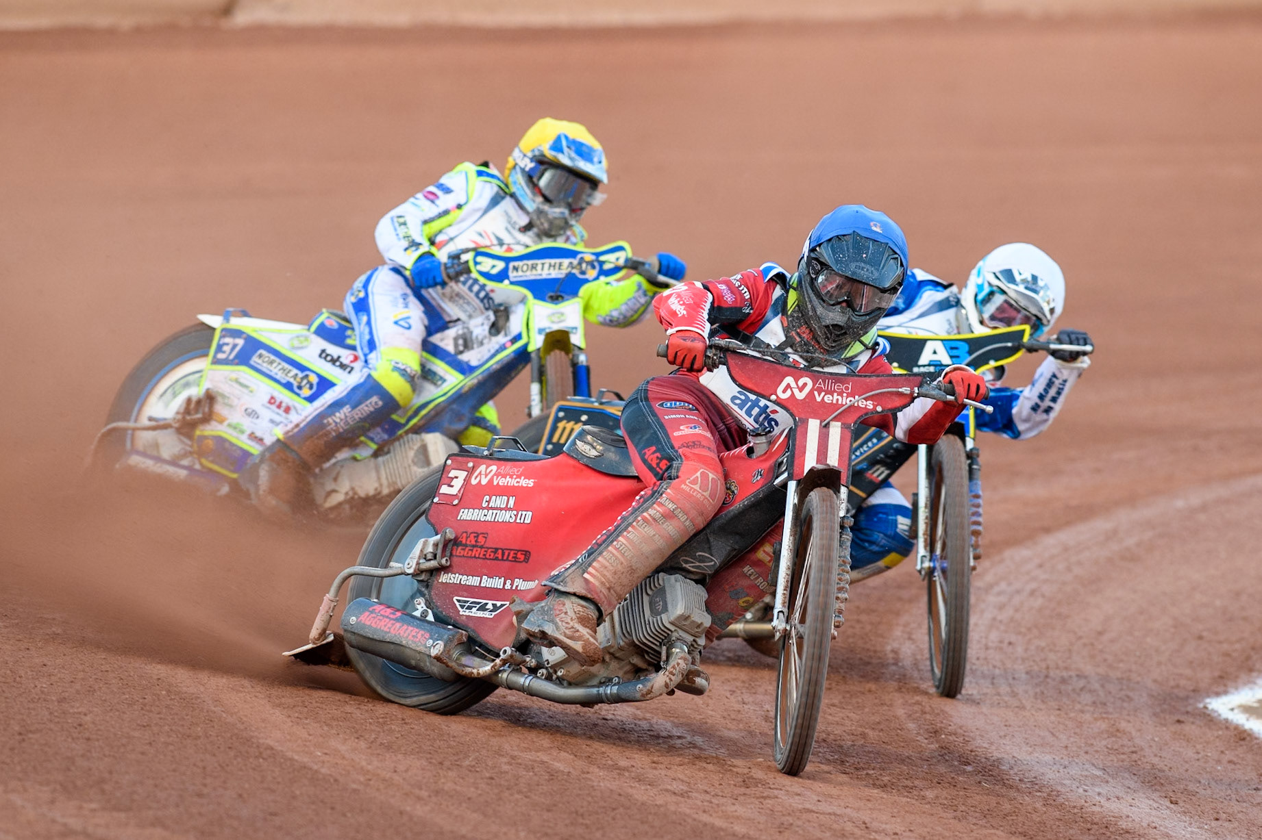Dan Thompson in Blue leading Steve Worrall in White and Chris Harris in Yellow during the Attis Insurance Sports Division British Final at the National Speedway Stadium, Manchester on Monday 12th May 2025. (Photo: Ian Charles | MI News)