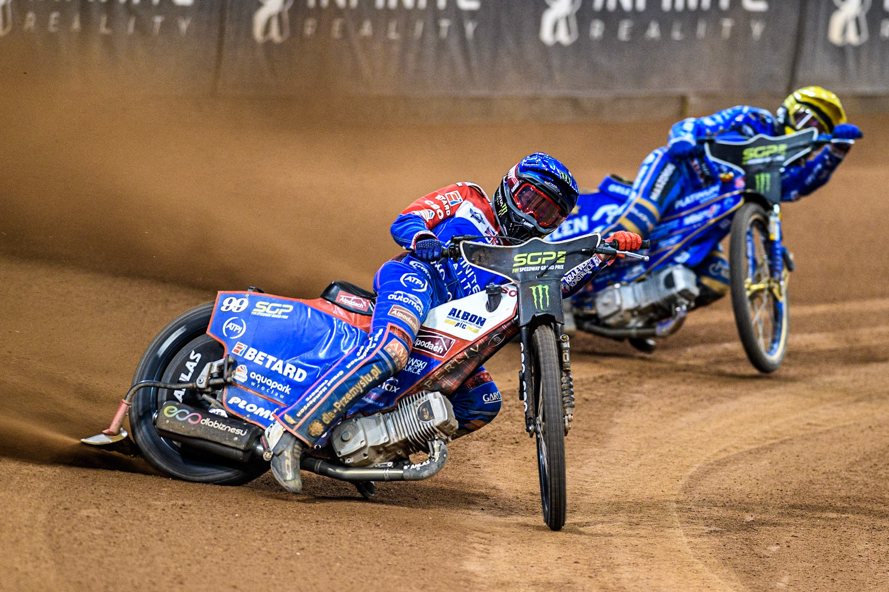Dan Bewley (99) (Blue) leads  Bartosz Zmarzlik (95) (Yellow) during the FIM Speedway Grand Prix of Great Britain at the Principality Stadium, Cardiff on Saturday 2nd September 2023. (Photo: Ian Charles | MI News)