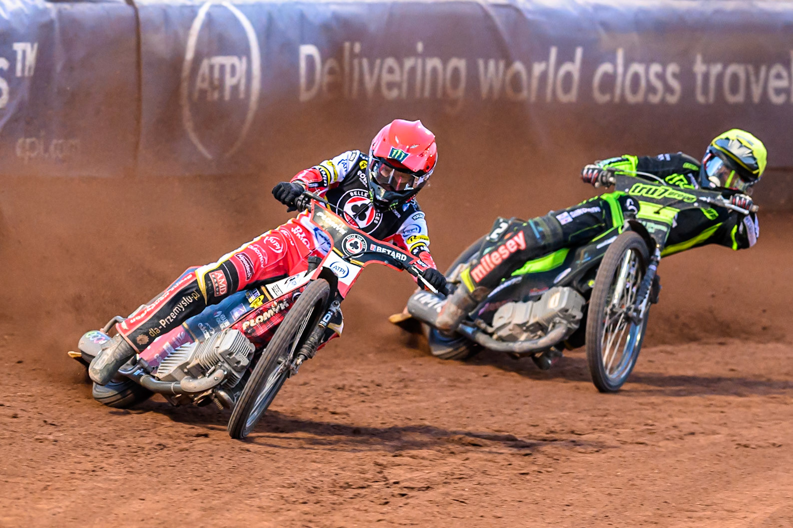 Dan Bewley of Belle Vue Aces  in Red leading Danny King of Ipswich Witches  in Yellow during the Rowe Motor Oil Premiership match between Belle Vue Aces and Ipswich Witches at the National Speedway Stadium, Manchester on Monday 4th August 2025. (Photo: Ian Charles | MI News)
