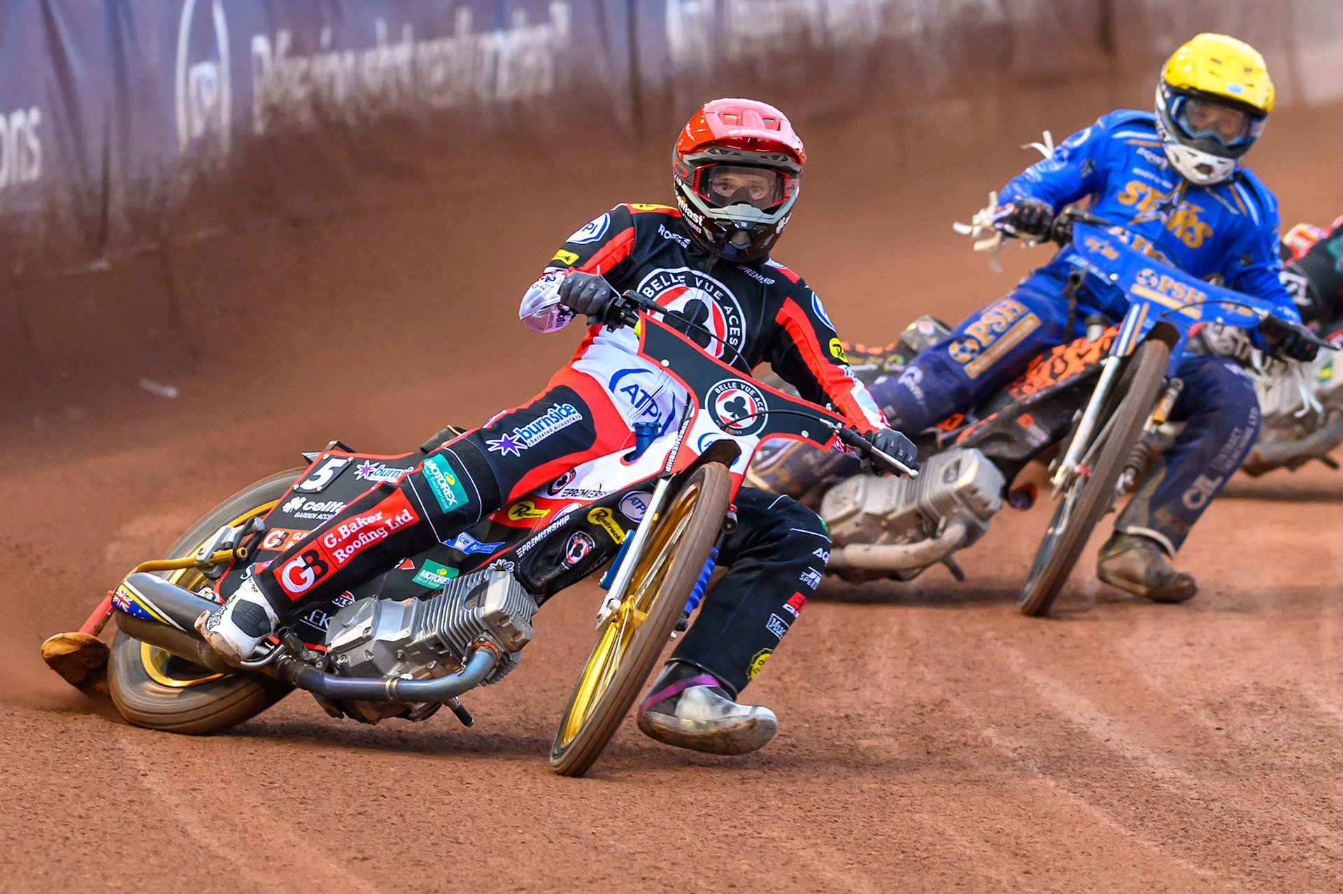 Jason Doyle of Belle Vue Aces in Red leading Cooper Rushen of Kings Lynn Stars in Yellow during the Rowe Motor Oil Premiership match between Belle Vue Aces and King's Lynn Stars at the National Speedway Stadium, Manchester on Monday 29th June 2026. (Photo: Ian Charles | MI News)