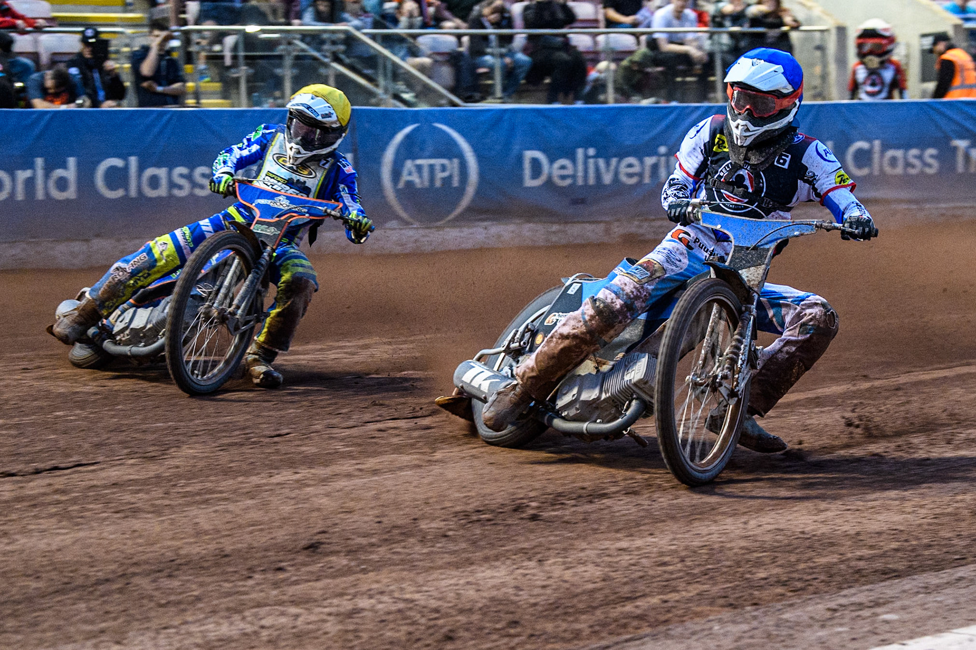 Belle Vue Aces' guest Antti Vuolas  in Blue rides inside Oxford Spires' Luke Killeen  in Yellow during the Rowe Motor Oil Premiership match between Belle Vue Aces and Oxford Spires at the National Speedway Stadium, Manchester on Monday 22nd July 2024. (Photo: Ian Charles | MI News)