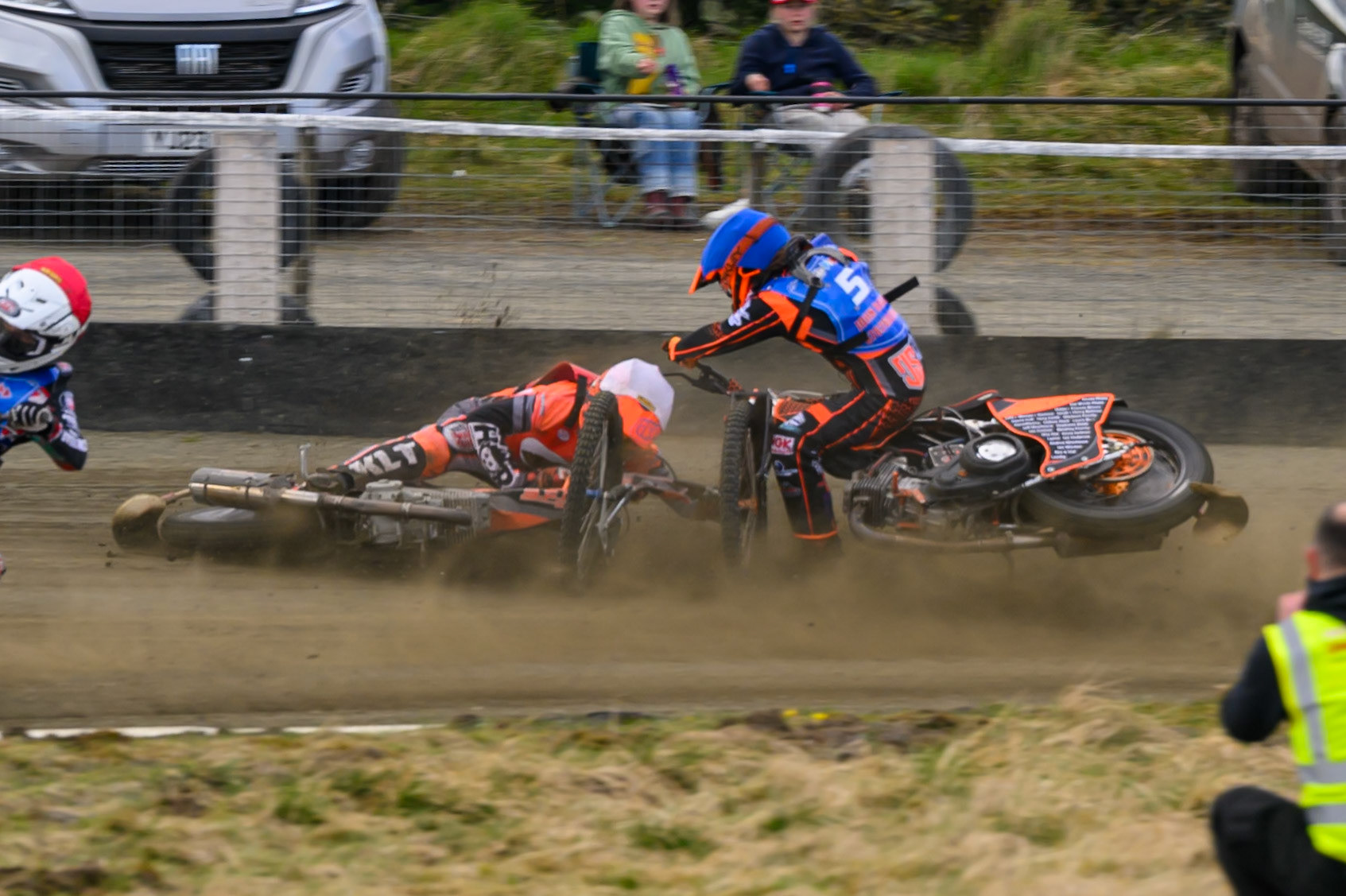 Connor Coles of NDL Nomads   in White fall and Jack Smith of Buxton Bulls   in Blue collides with him during the  Challenge match between Buxton Bulls and NDL Nomads at Hi-Edge Speedway, Buxton on Sunday 19th April 2026. (Photo: Ian Charles | MI News)