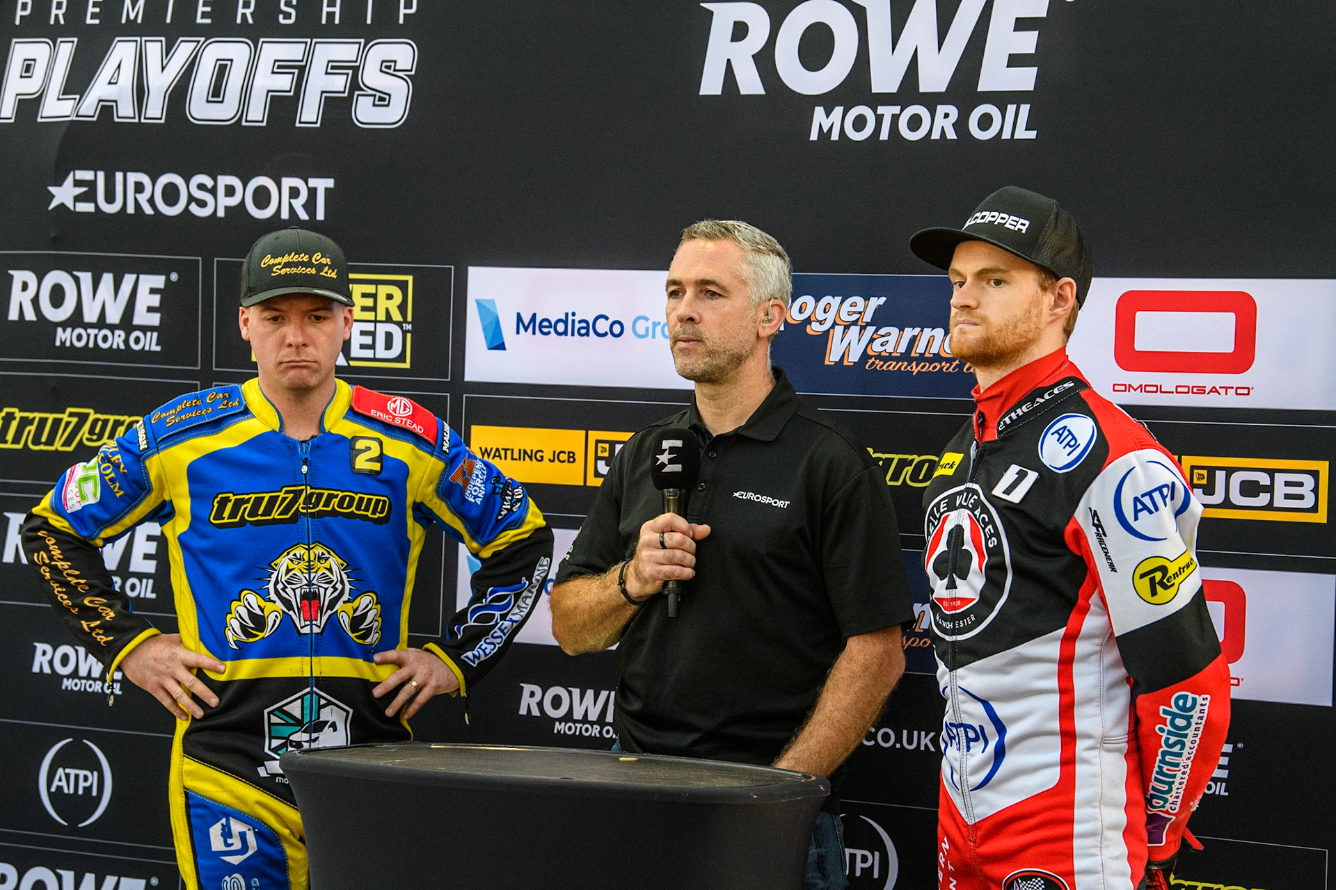 (L to R) Sheffield Tigers' Kyle Howarth , Eurosport Presenter Scott Nicholls, and Belle Vue Aces' Brady Kurtz  wait for the TV Cameras to record the coin toss during the Rowe Motor Oil Premiership Play Off Semi Final 2, 1st Leg match between Belle Vue Aces and Sheffield Tigers at the National Speedway Stadium, Manchester on Monday 16th September 2024. (Photo: Ian Charles | MI News)