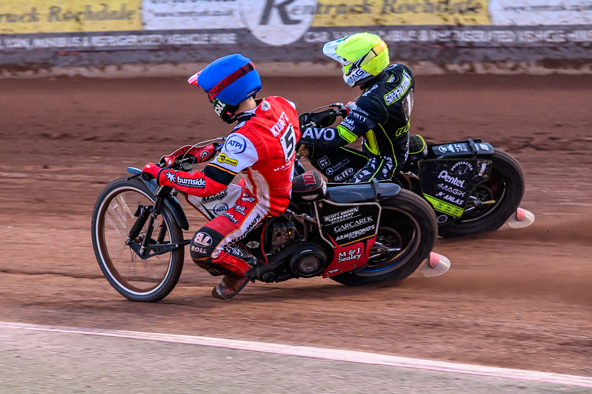 Belle Vue Aces' Brady Kurtz in Blue rides inside Ipswich Witches' Emil Saifutdinov  in Yellow during the Rowe Motor Oil Premiership match between Belle Vue Aces and Ipswich Witches at the National Speedway Stadium, Manchester on Monday 30th June 2025. (Photo: Ian Charles | MI News)