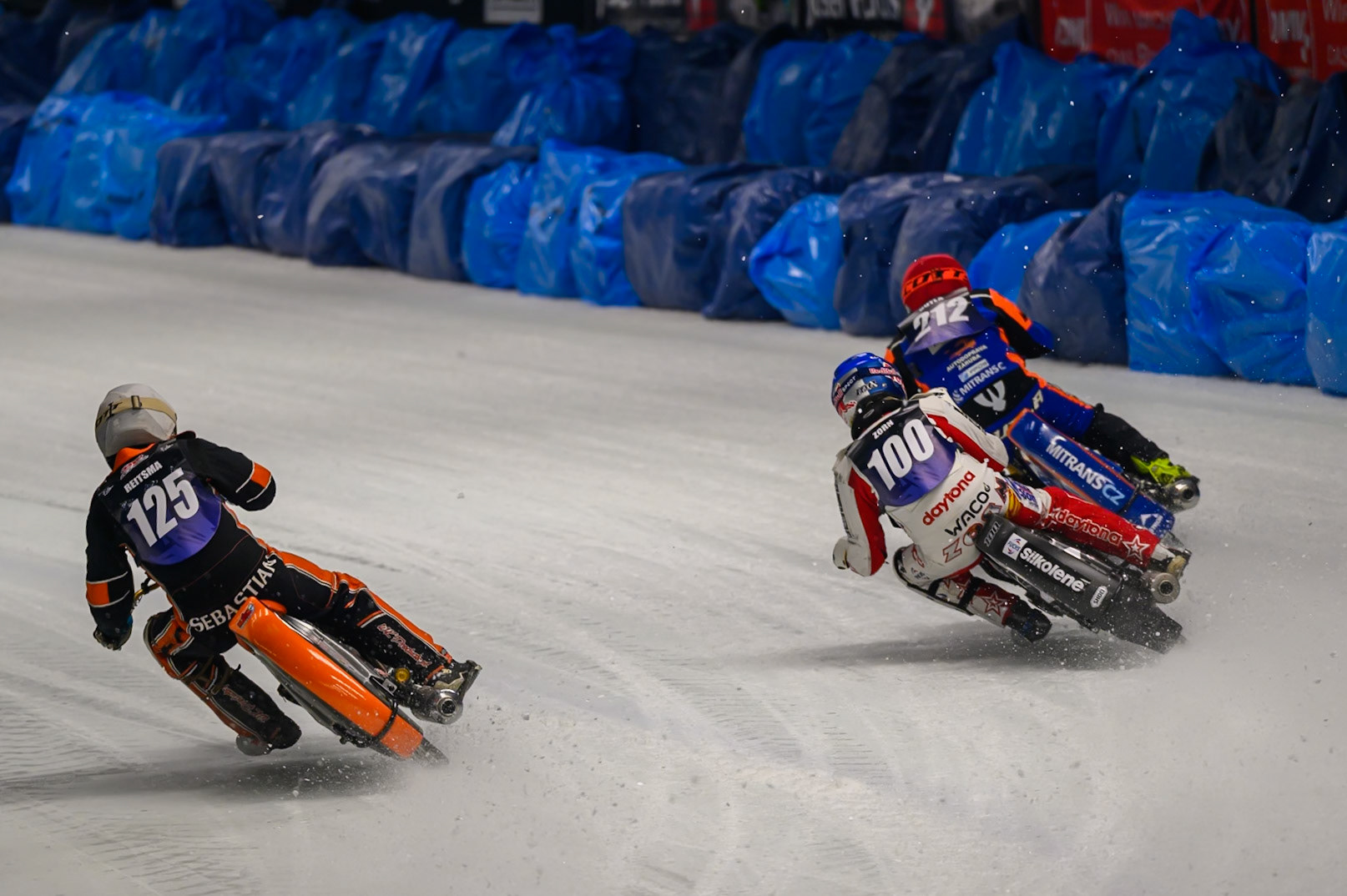 Sebastian Reitsma (125) of The Netherlands  in White cuts back inside Franz Zorn (100) of Austria  in Blue and Ove Ledström (97) of Sweden  in Red during the Ice Speedway Gladiators World Championship Final 1 at Max-Aicher-Arena, Inzell on Saturday 14th March 2026. (Photo: Ian Charles | MI News)