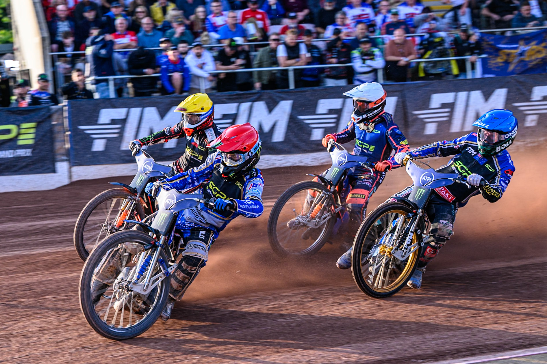 Jack Holder (25) of Australia in Red rides inside January Kvech (201) of Czech Republic in Yellow with Jason Doyle (69) of Australia in Blue and Andzejs Lebedevs (29) of Latvia in White behind during the ATPI FIM Speedway Grand Prix Round 5 at the National Speedway Stadium, Manchester, on Saturday 14th June 2025. (Photo: Ian Charles | MI News)