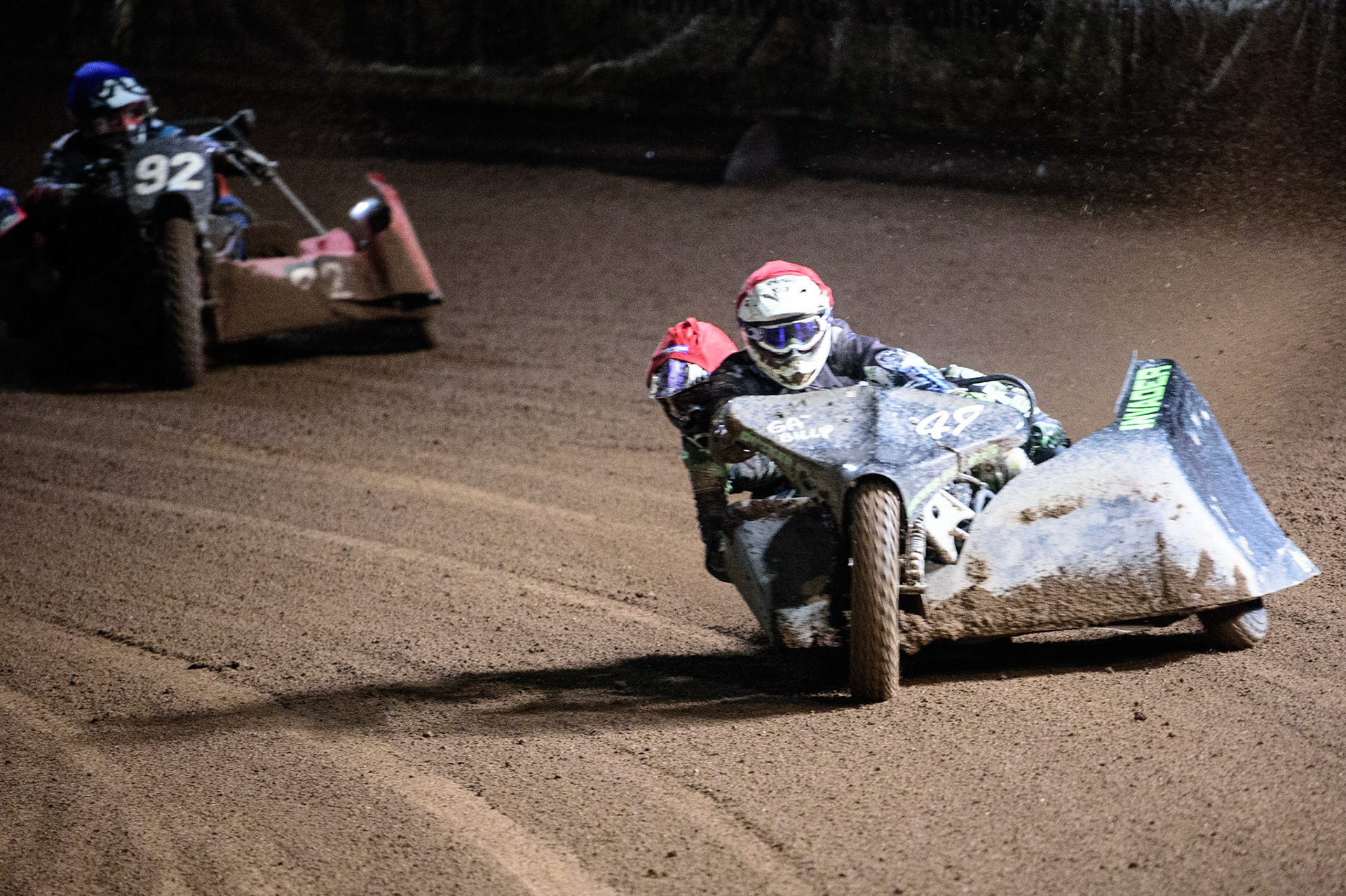 MANCHESTER, UK. OCT 30TH   Gareth Winterburn &amp; Bradley Atkinson  (Red) leads Paul Whitelam &amp; Richard Webb  (Blue) during the Manchester Masters Sidecar Speedway and Flat Track Racing at the National Speedway Stadium, Manchester on Saturday 30th October 2021. (Credit: Ian Charles | MI News)