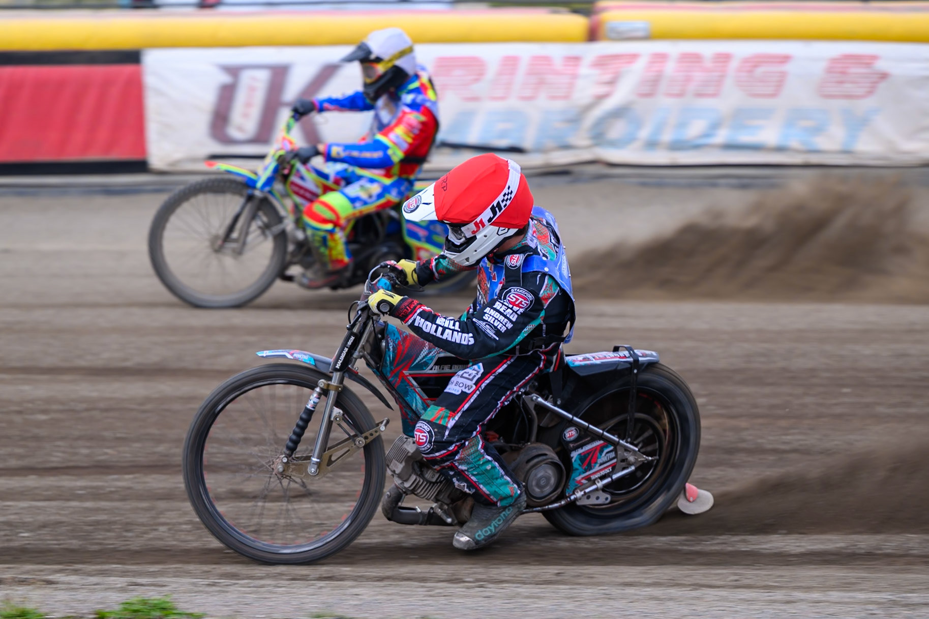 Alfie Bowtell of Buxton Bulls in Red on the inside of Simon Lambert of Kings Lynn Young Stars in White during the WSRA National Development League match between Buxton Bulls and King's Lynn Young Stars at Hi-Edge Speedway, Buxton on Sunday 9th August 2026. (Photo: Ian Charles | MI News)