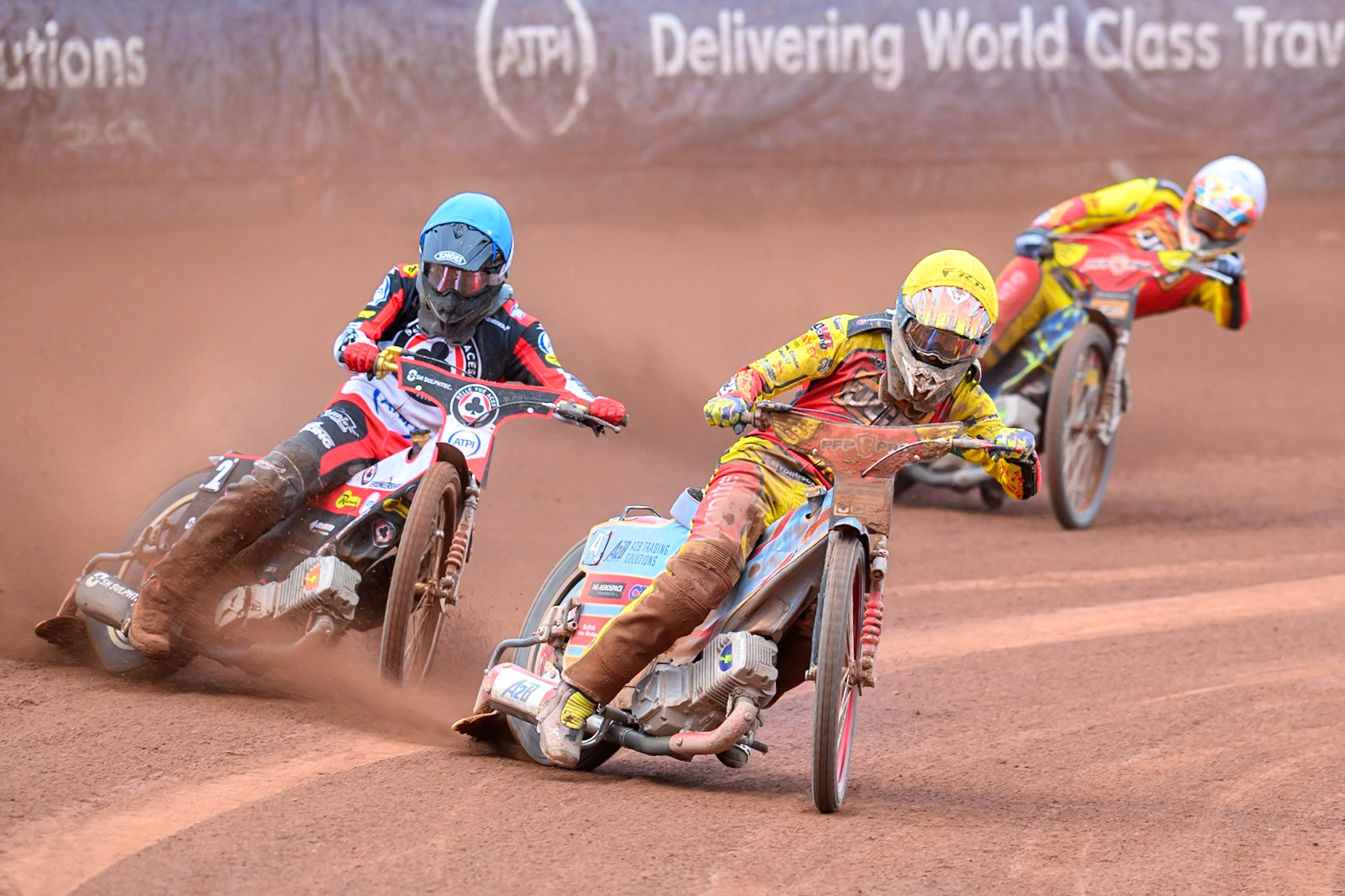 Drew Kemp of Leicester Lions in Yellow leading Norick Blödorn of Belle Vue Aces in Blue and Nick Morris of Leicester Lions in White during the Rowe Motor Oil Premiership match between Belle Vue Aces and Leicester Lions at the National Speedway Stadium, Manchester on Monday 15th June 2026. (Photo: Ian Charles | MI News)