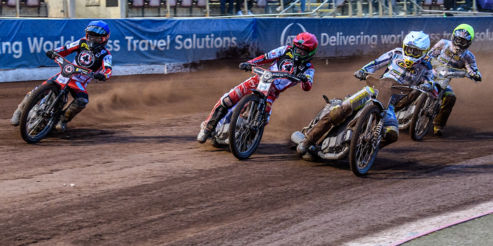 Oxford Spires' Maciej Janowski in White rides inside Belle Vue Aces' Dan Bewley in Red and Belle Vue Aces' Ben Cook in Blue with Oxford Spires' Rohan Tungate in Yellow behind during the Rowe Motor Oil Premiership match between Belle Vue Aces and Oxford Spires at the National Speedway Stadium, Manchester on Monday 13th May 2024. (Photo: Ian Charles | MI News)