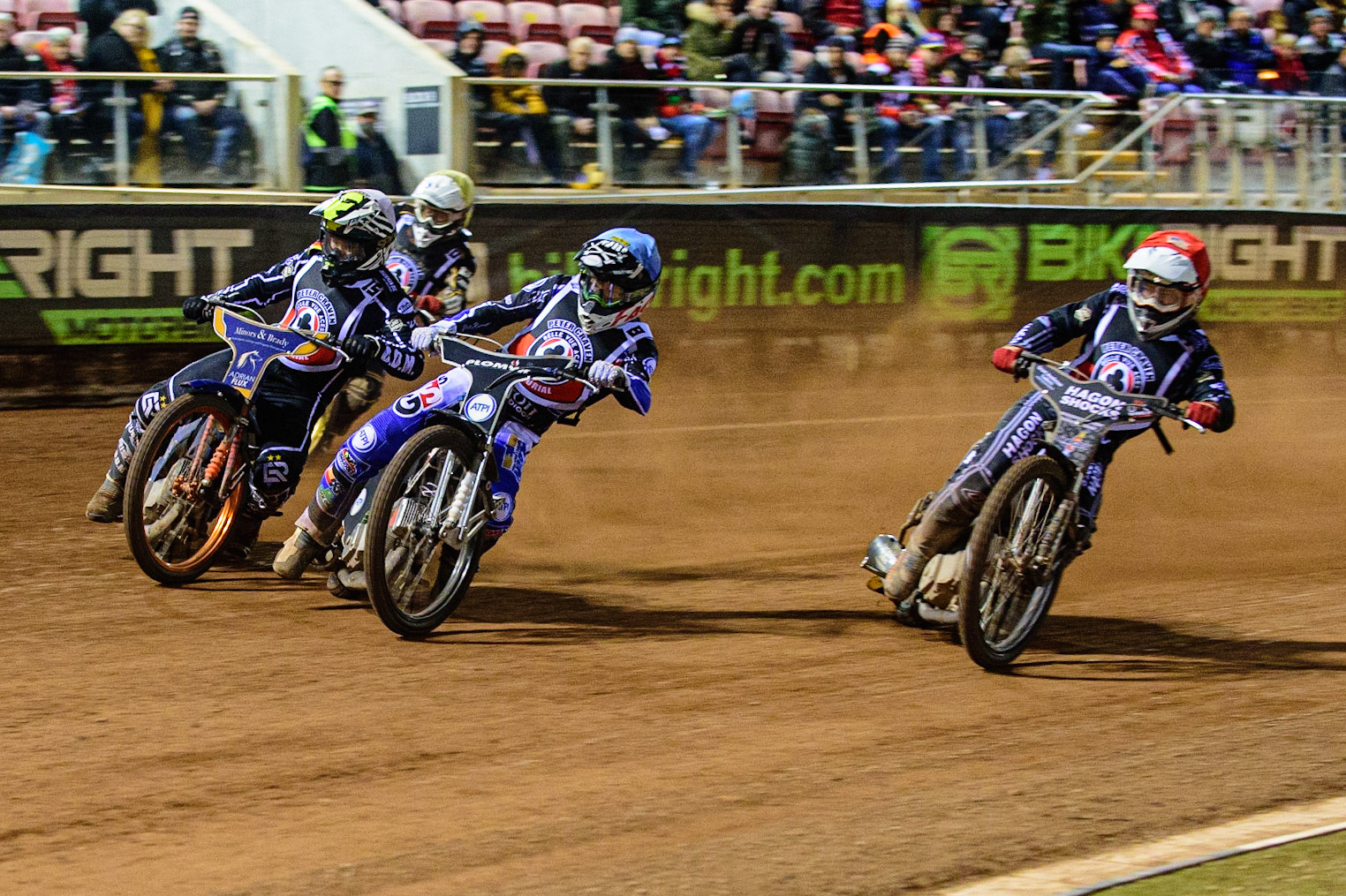 MANCHESTER, UK. OCT 23RD  Dan Bewley  (Blue) leads Broc Nicol  (Red), Erik Riss  (White) and Nick Blödorn  (Yellow) during the Peter Craven Memorial Trophy event at the National Speedway Stadium, Manchester on Saturday 23rd October 2021. (Credit: Ian Charles | MI News)
