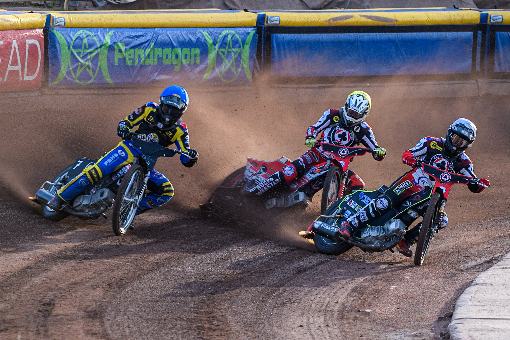 Tom Brennan (White) and Connor Bailey (Yellow) inside Dan Gilkes (Blue) during the Sports Insure Premiership match between Sheffield Tigers and Belle Vue Aces at Owlerton Stadium, Sheffield on Thursday 20th July 2023. (Photo: Ian Charles | MI News)