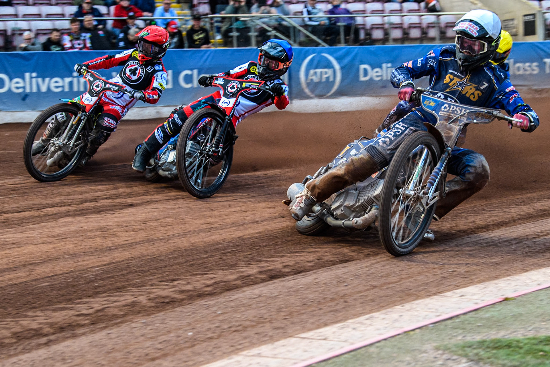 King Lynn Stars' Anders Rowe in White rides inside Belle Vue Aces' Ben Cook in Blue  and Belle Vue Aces' Jaimon Lidsey in Red with King Lynn Stars' Patryk Wojdylo in Yellow behind during the Rowe Motor Oil Premiership match between Belle Vue Aces and King's Lynn Stars at the National Speedway Stadium, Manchester on Monday 20th May 2024. (Photo: Ian Charles | MI News)