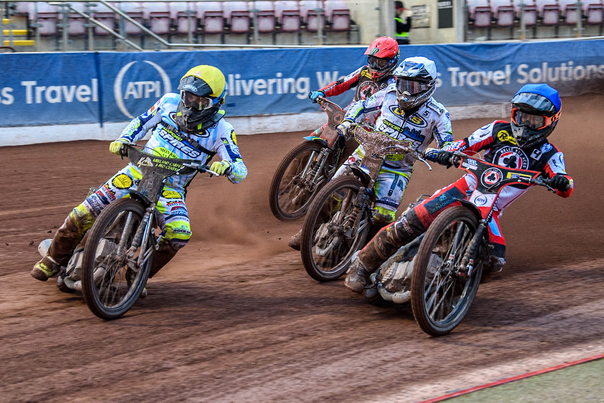 Belle Vue Aces' Ben Cook in Blue rides inside Oxford Spires' Craig Cook in Yellow and Chris Harris in White with Belle Vue Aces' Jaimon Lidsey behind during the Rowe Motor Oil Premiership match between Belle Vue Aces and Oxford Spires at the National Speedway Stadium, Manchester on Monday 13th May 2024. (Photo: Ian Charles | MI News)