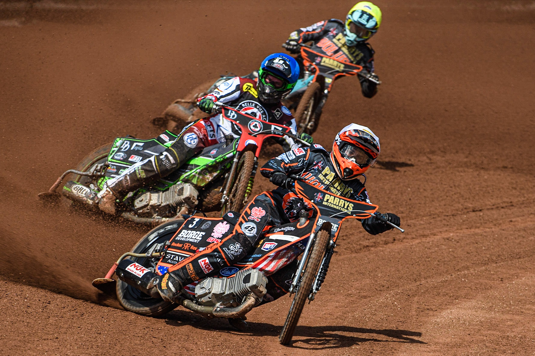 Luke Becker (White) leads Charles Wright (Blue) and Ryan Douglas (Yellow) during the Sports Insure Premiership match between Belle Vue Aces and Wolverhampton Wolves at the National Speedway Stadium, Manchester on Monday 29th May 2023. (Photo: Ian Charles | MI News)